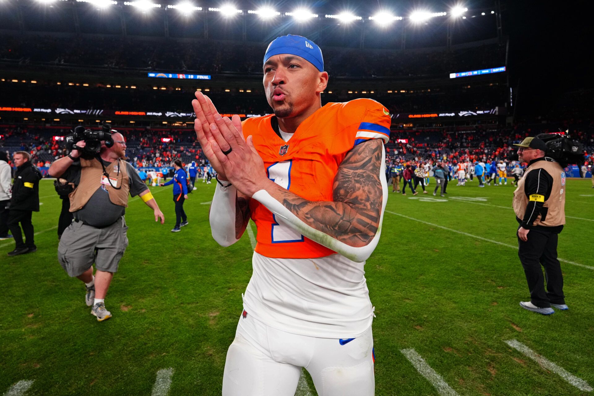 Denver Broncos tight end Evan Engram (1) looks on after winning the game against the Los Angeles Chargers at Empower Field at Mile High.