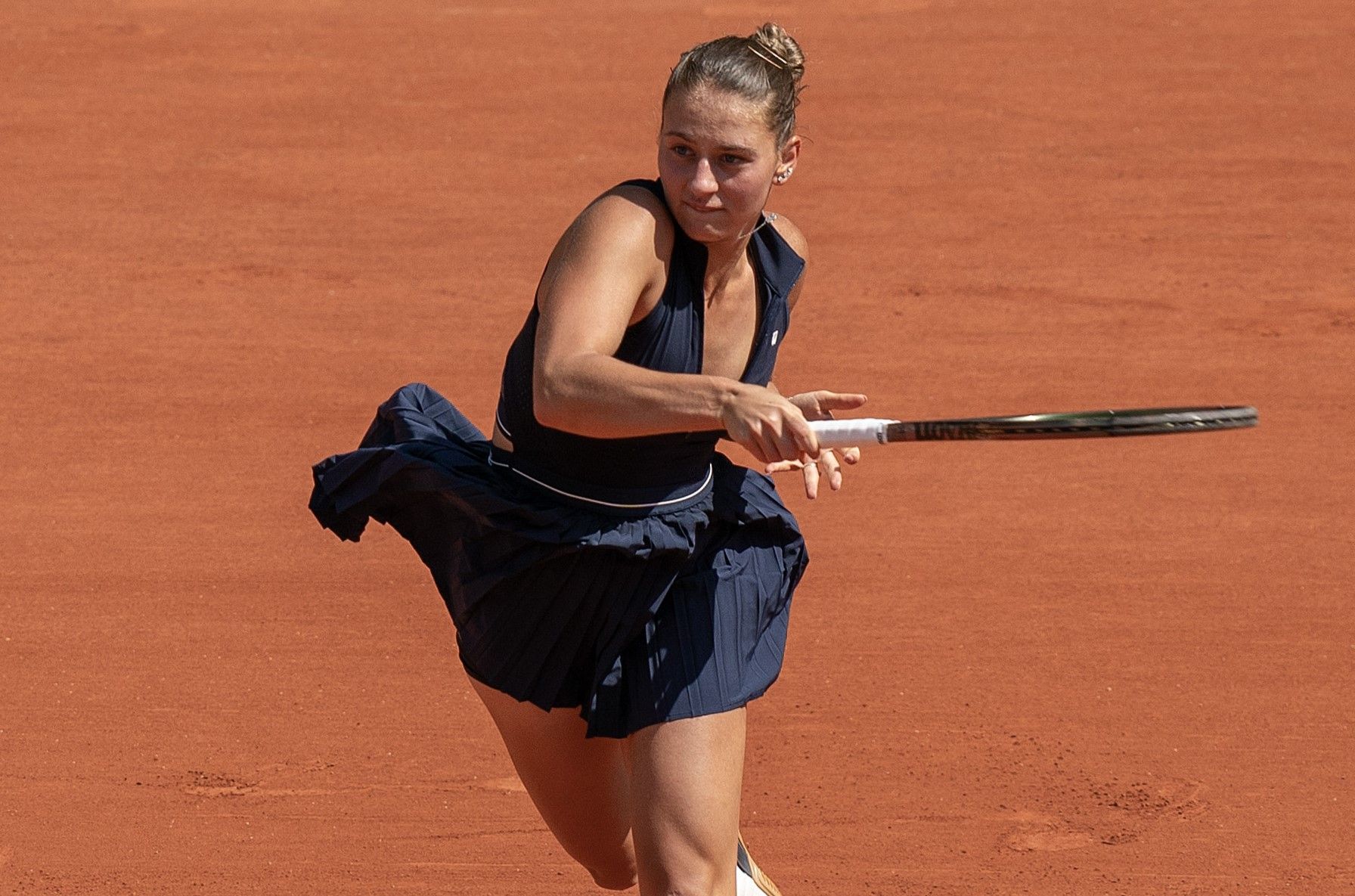 Marta Kostyuk (UKR) returns a shot in her first round match against Aryna Sabalenka on day one at Stade Roland-Garros.