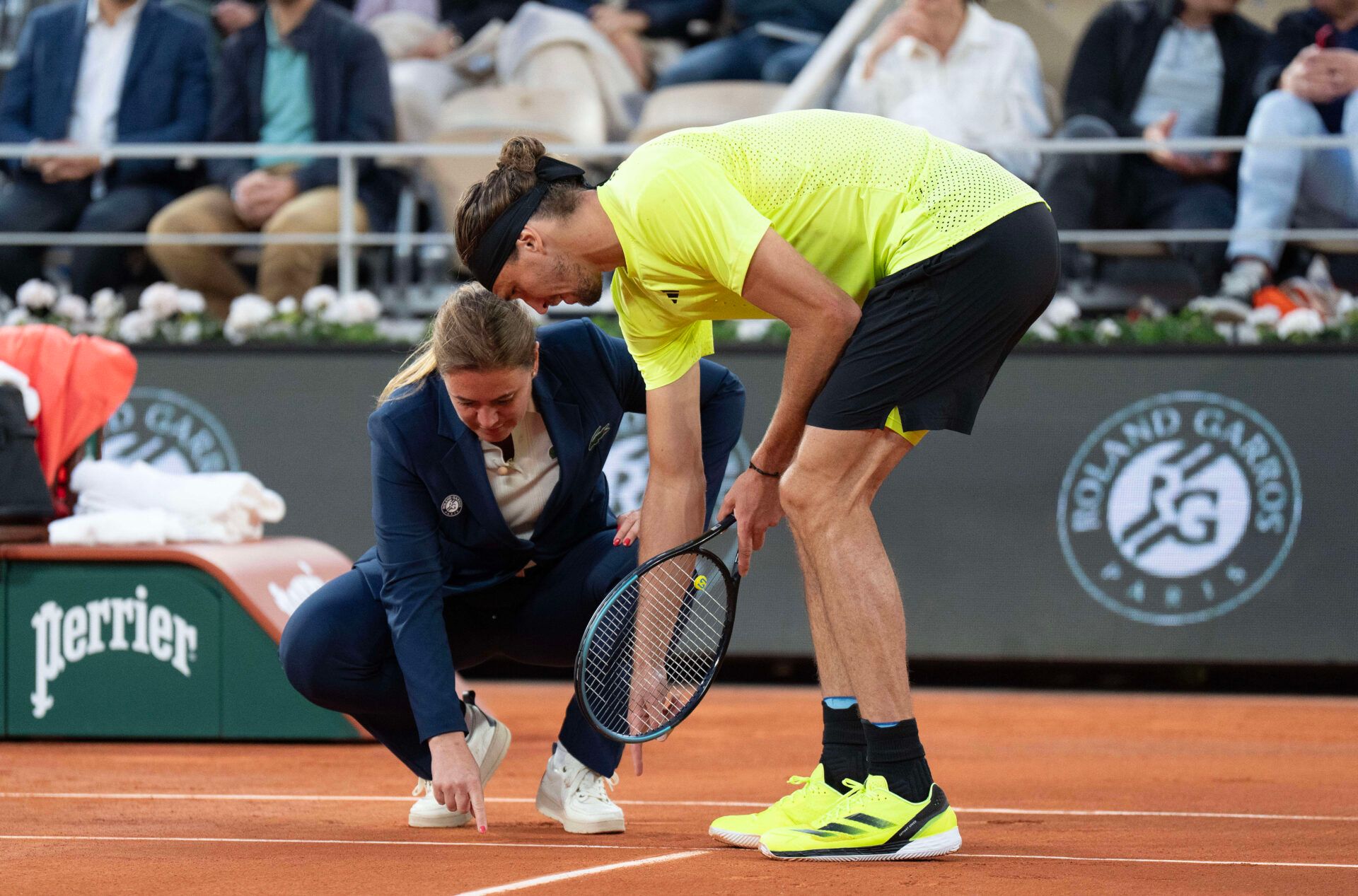 Alexander Zverev of Germany questions Chair Umpire, Louise Azemar Engzell of Sweden, during his match against Novak Djokovic of Serbia on day 11 at Roland Garros Stadium.