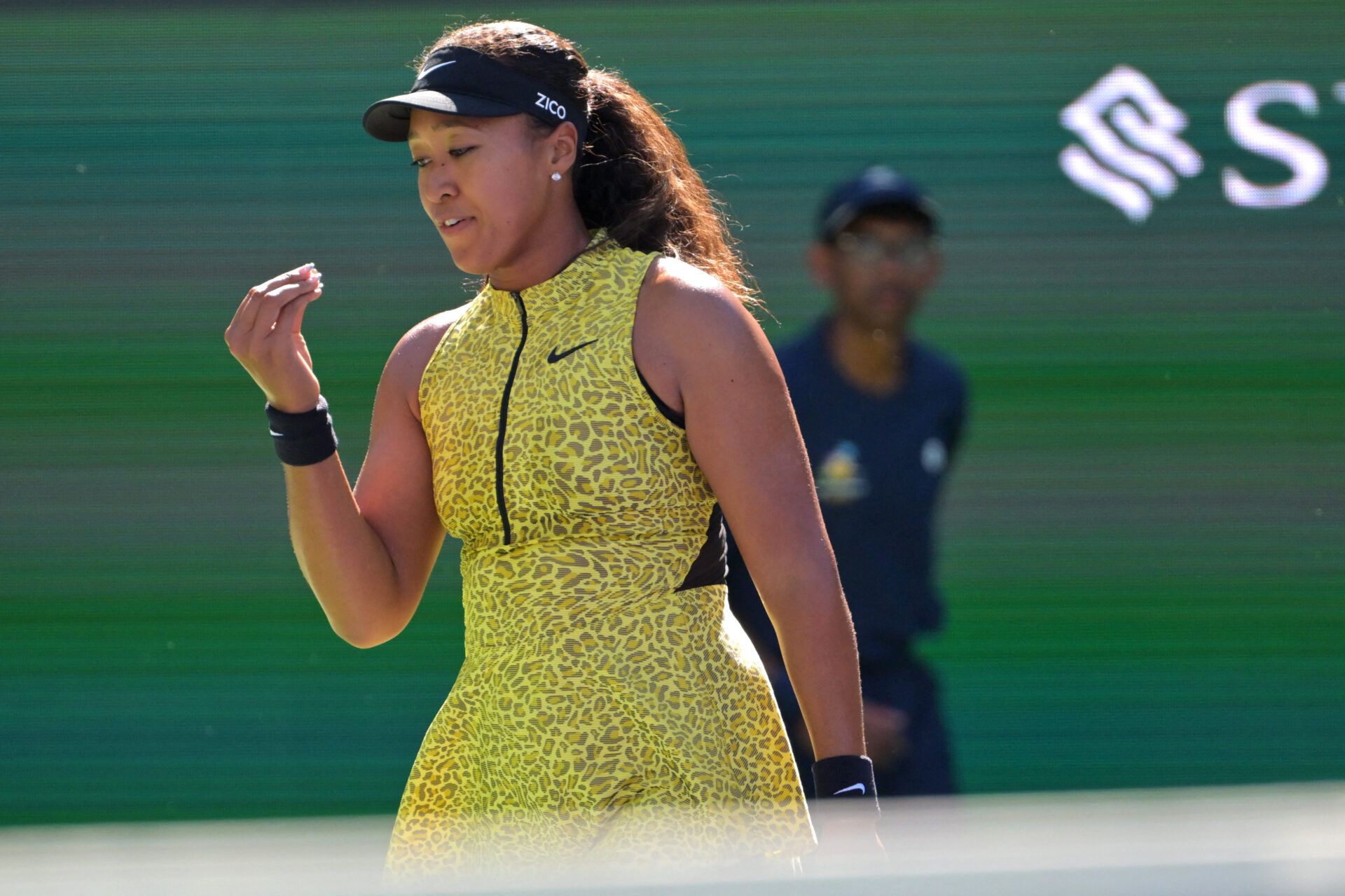 Naomi Osaka (JPN) gestures to herself after missing a shot during her third round match against Camila Osorio (COL) in the BNP Paribas Open at the Indian Wells Tennis Garden.