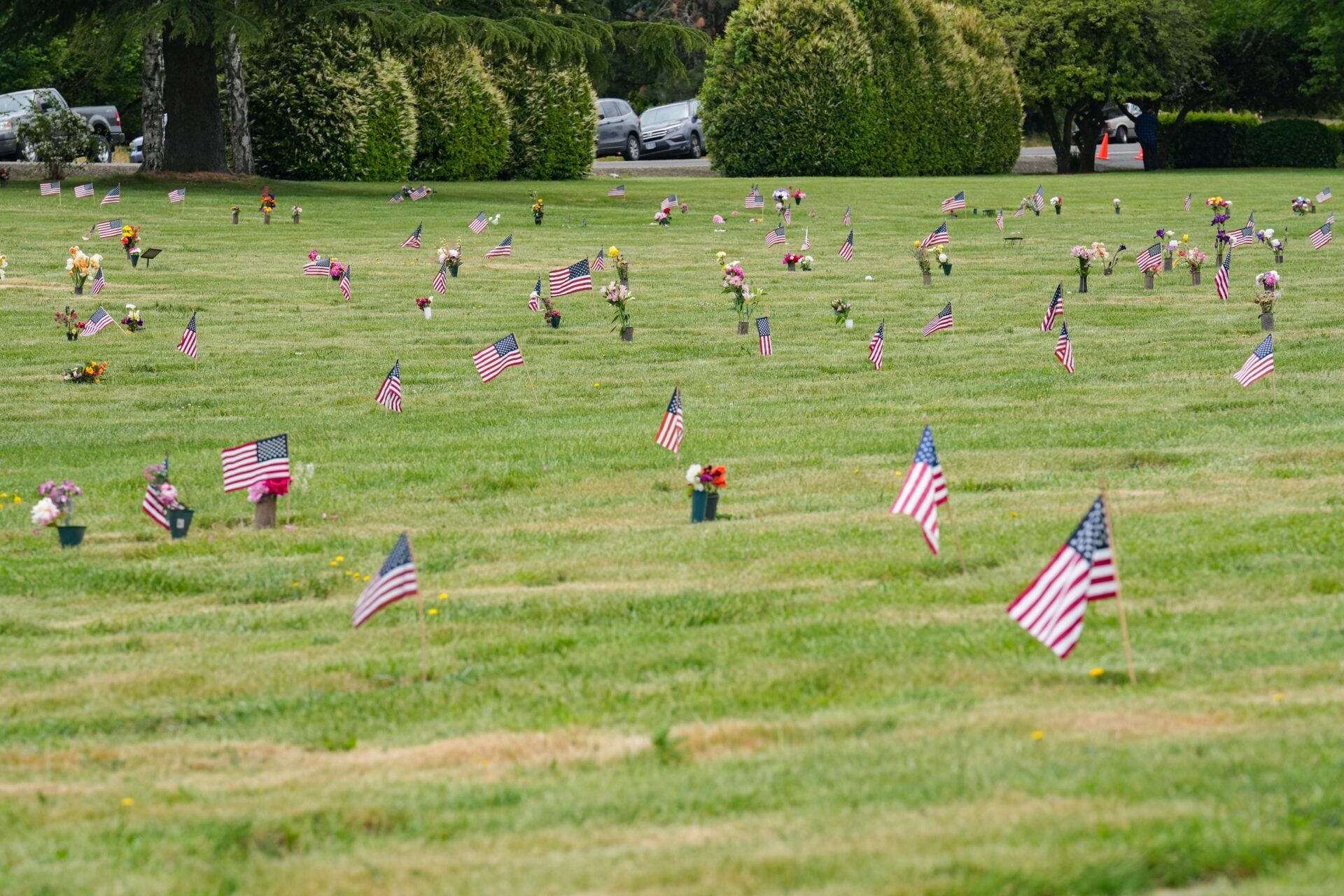 American flags line part of Restlawn Cemetery during a Memorial Day ceremony on Monday, May 25, 2025, in Salem, Ore.