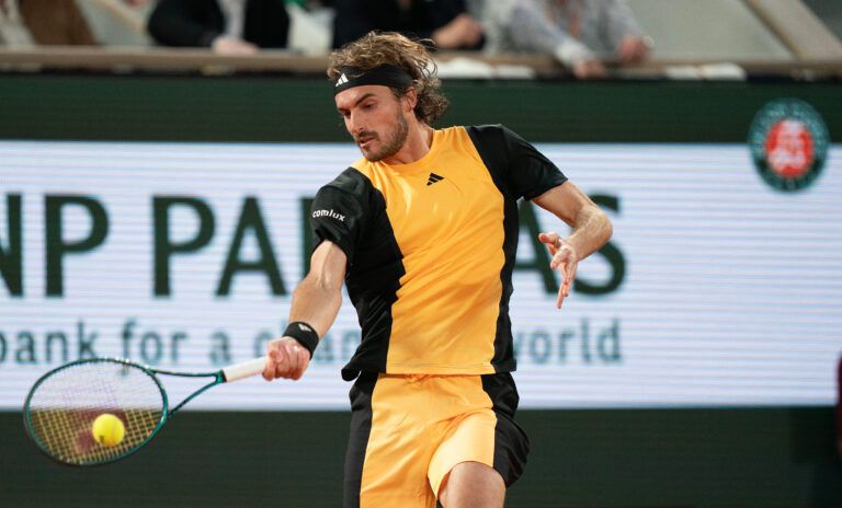 Stefanos Tsitsipas of Greece returns a shot during his match against Carlos Alcaraz of Spain on day 10 of Roland Garros at Stade Roland Garros.
