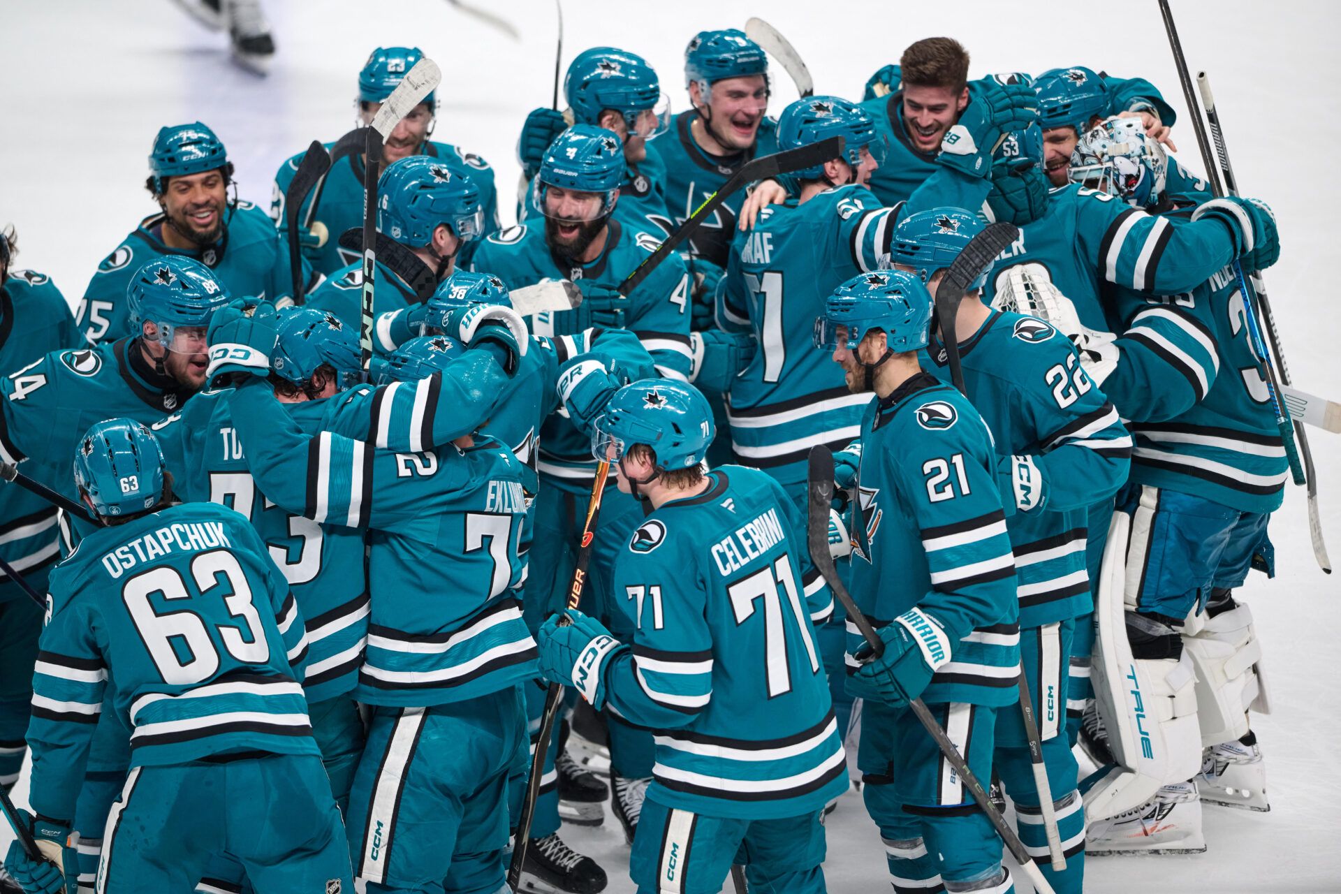 San Jose Sharks players celebrate on the ice at SAP Center.