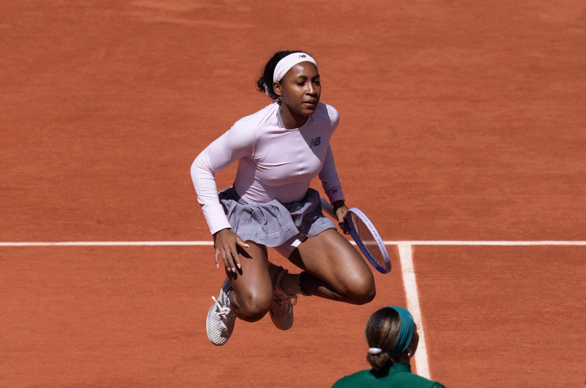 Coco Gauff of the United States warms up during the coin toss for her match against Taylor Townsend of the United States on day three at Stade Roland Garros.
