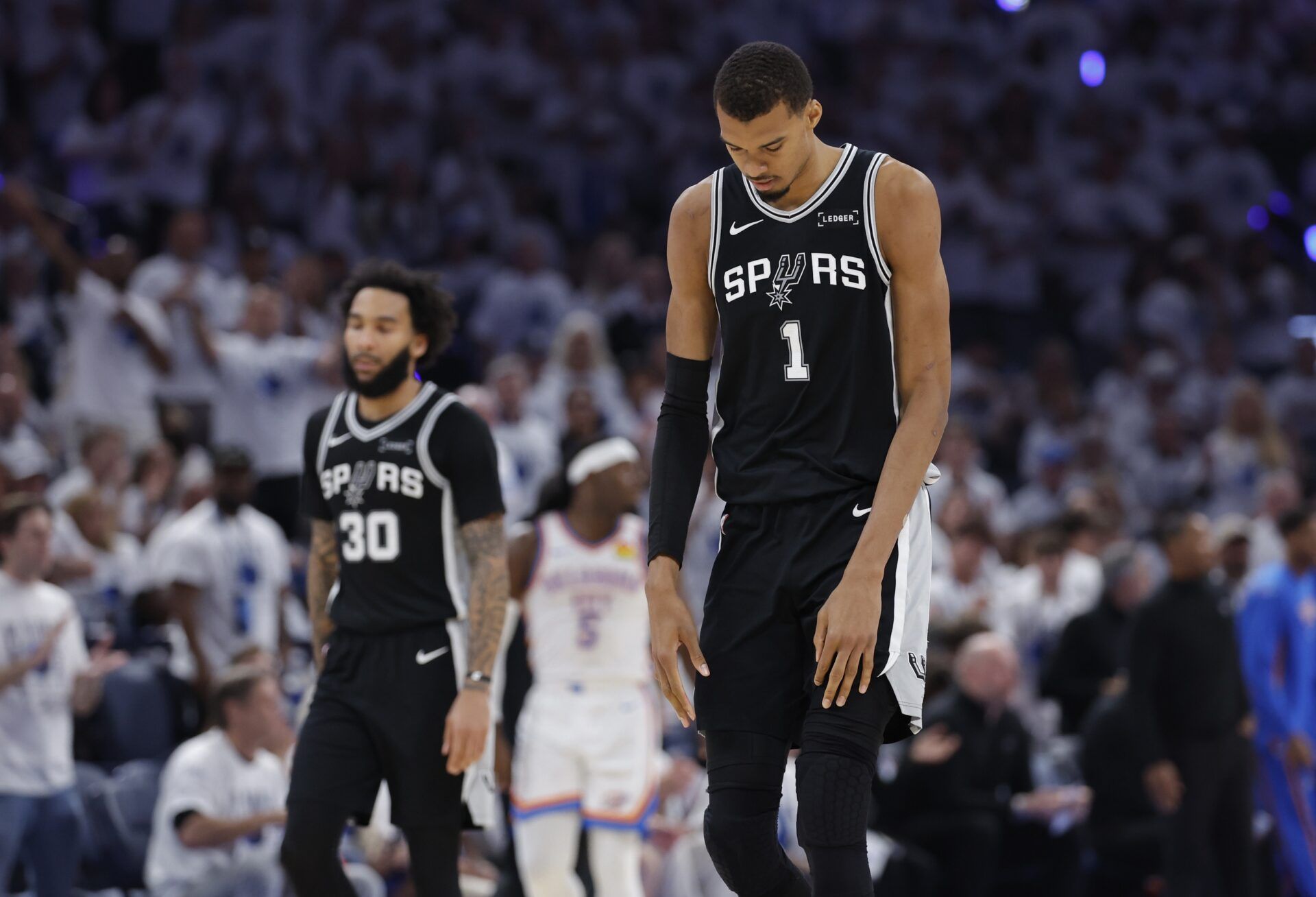 San Antonio Spurs forward Victor Wembanyama (1) reacts after a play during the third quarter against the Oklahoma City Thunder in game five of the western conference finals for the 2026 NBA playoffs at Paycom Center.