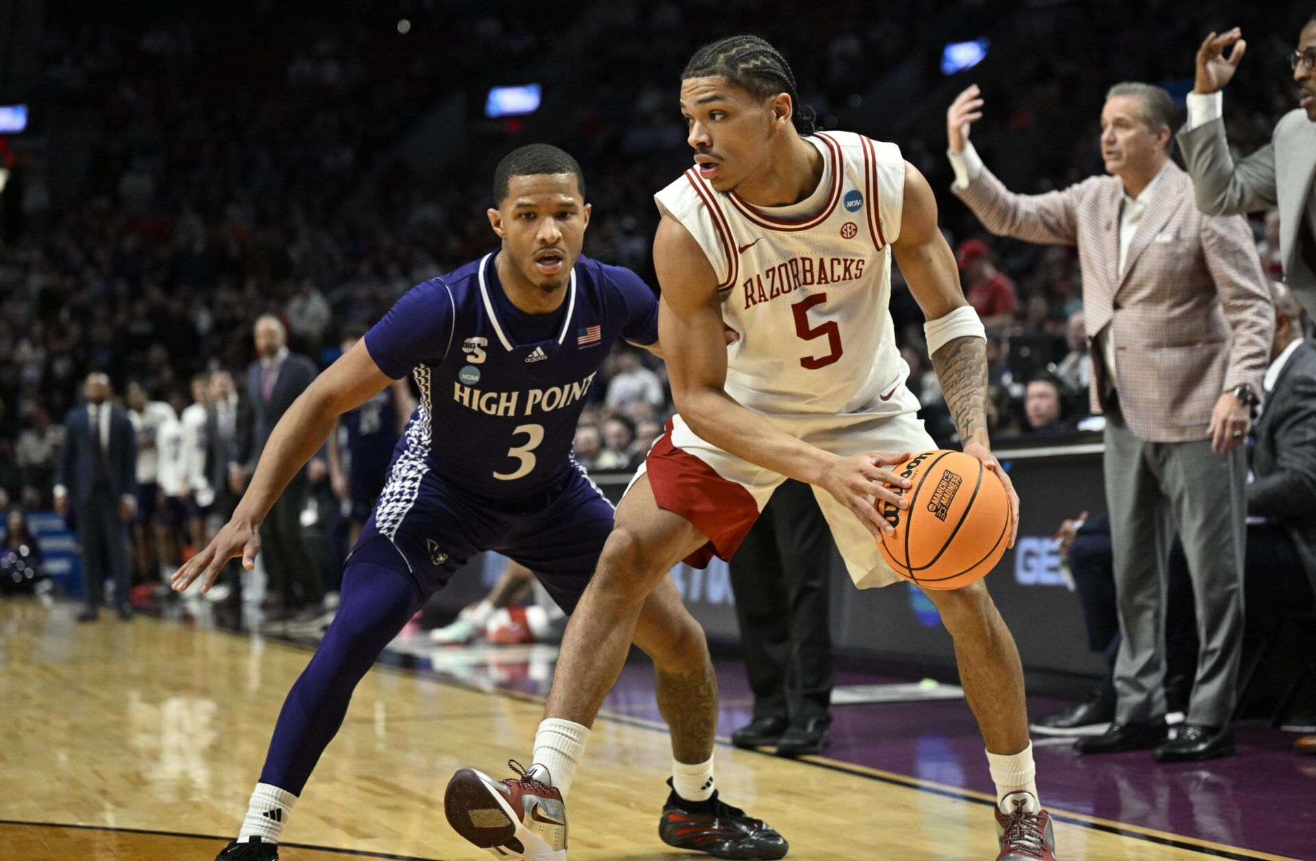 Arkansas Razorbacks guard Darius Acuff Jr. (5) drives against High Point Panthers guard Rob Martin (3) in the second half during a second round game of the men's 2026 NCAA Tournament at Moda Center.