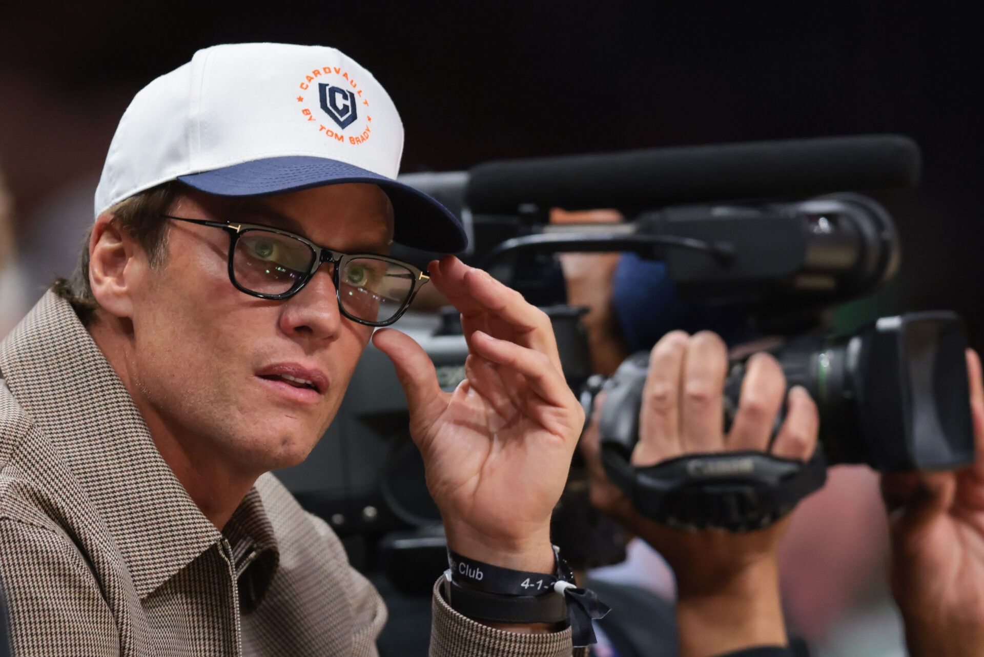Tom Brady attends the game between the Miami Heat and the Boston Celtics at Kaseya Center.