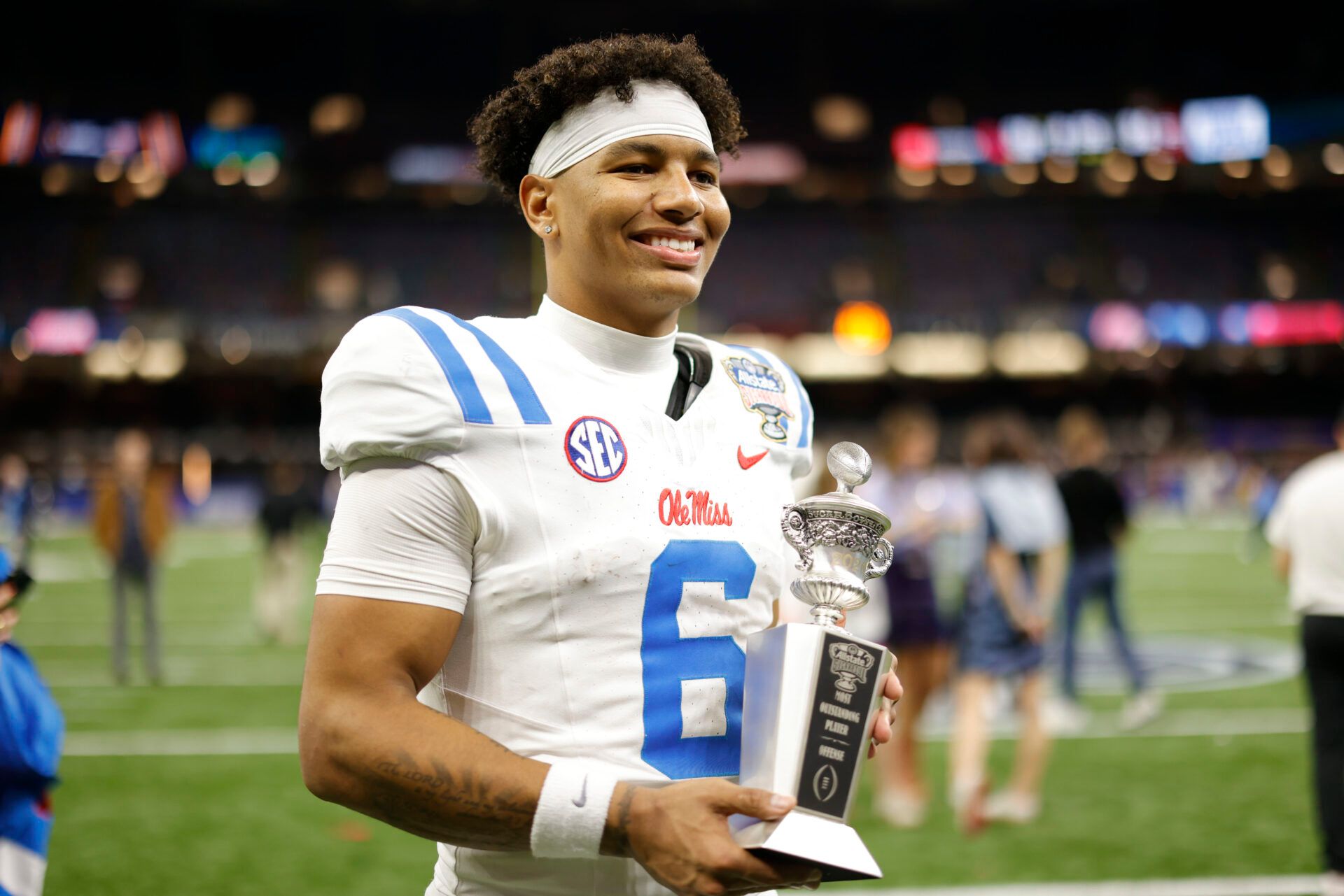 Mississippi Rebels quarterback Trinidad Chambliss (6) poses for a photo with the MVP trophy after the 2026 Sugar Bowl and quarterfinal game of the College Football Playoff against the Georgia Bulldogs at Caesars Superdome.