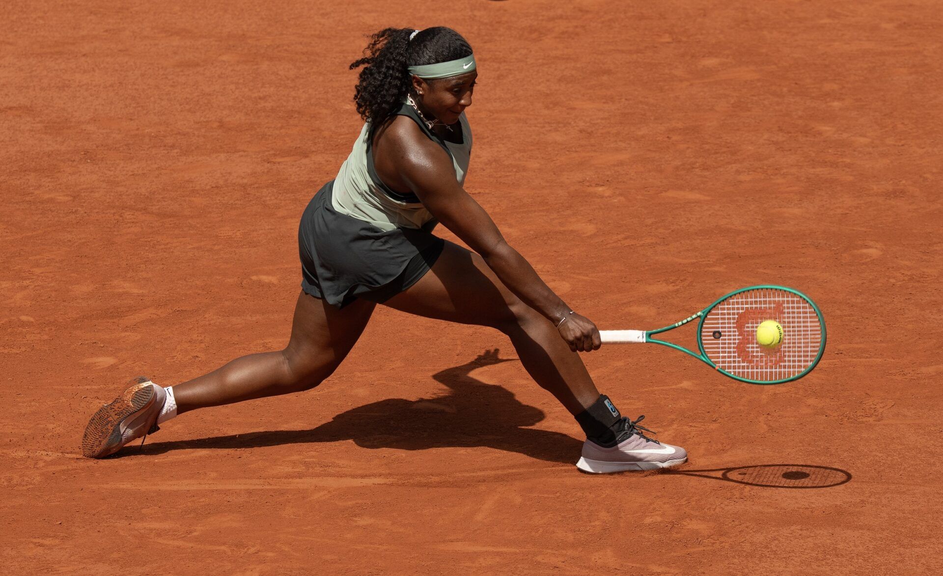 Hailey Baptiste of the United States returns a shot in her first round match against Barbora Krejcikova of the Czech Republic on day one at Stade Roland Garros.