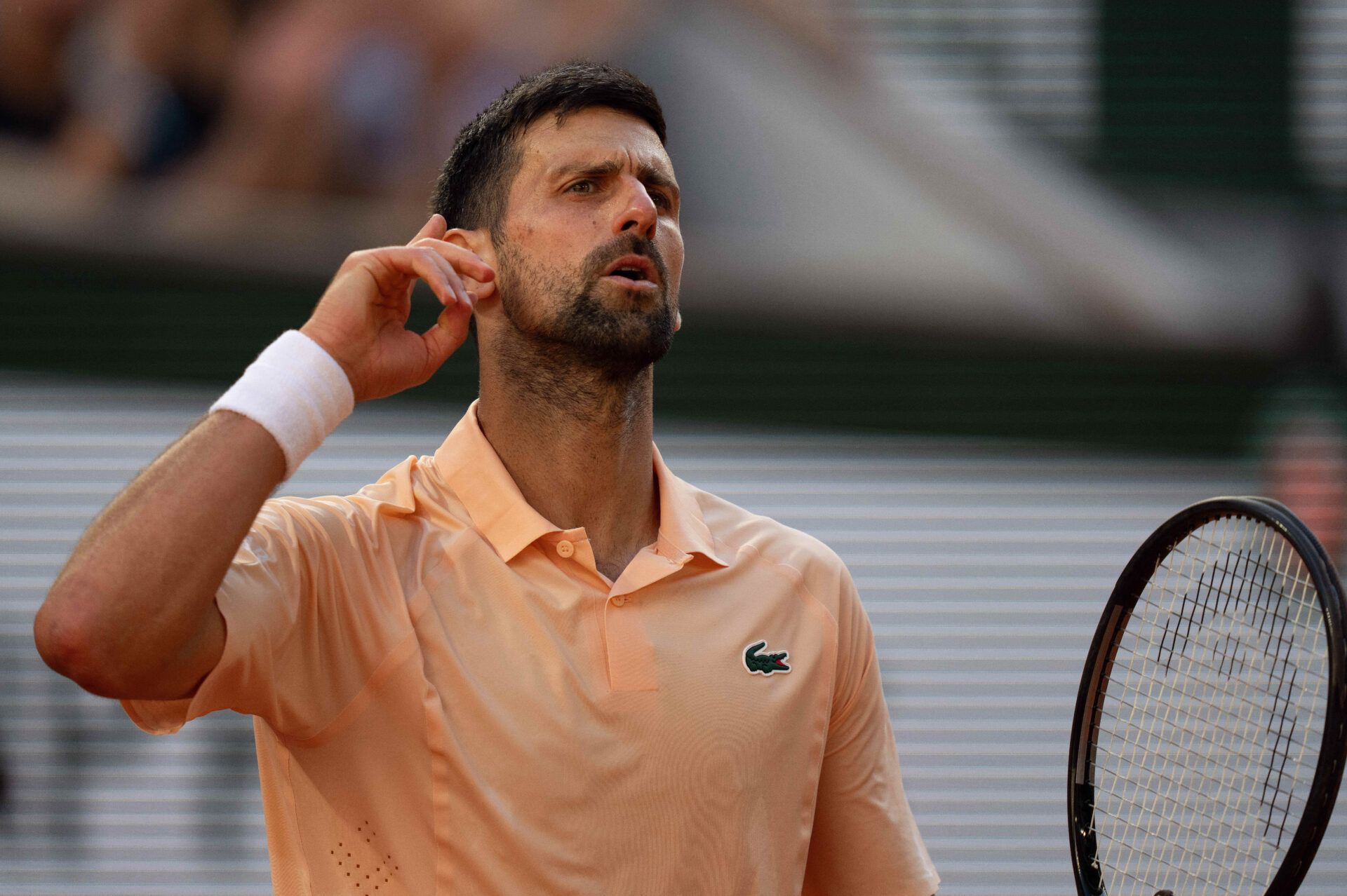 Novak Djokovic of Serbia reacts during his match against Valentin Royer of France on day four at Stade Roland Garros.