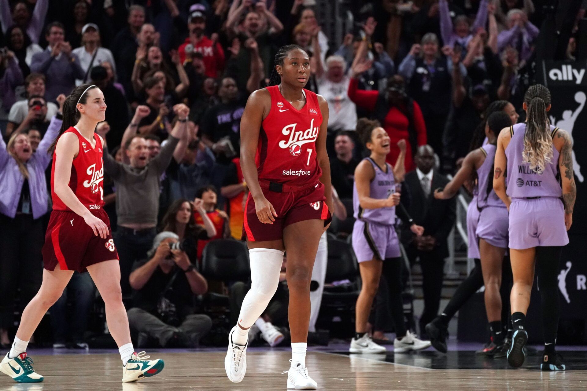 Indiana Fever center-forward Aliyah Boston (7) and guard Caitlin Clark (22) walk off the court after the buzzer sounds the fourth quarter against the Golden State Valkyries at Chase Center.