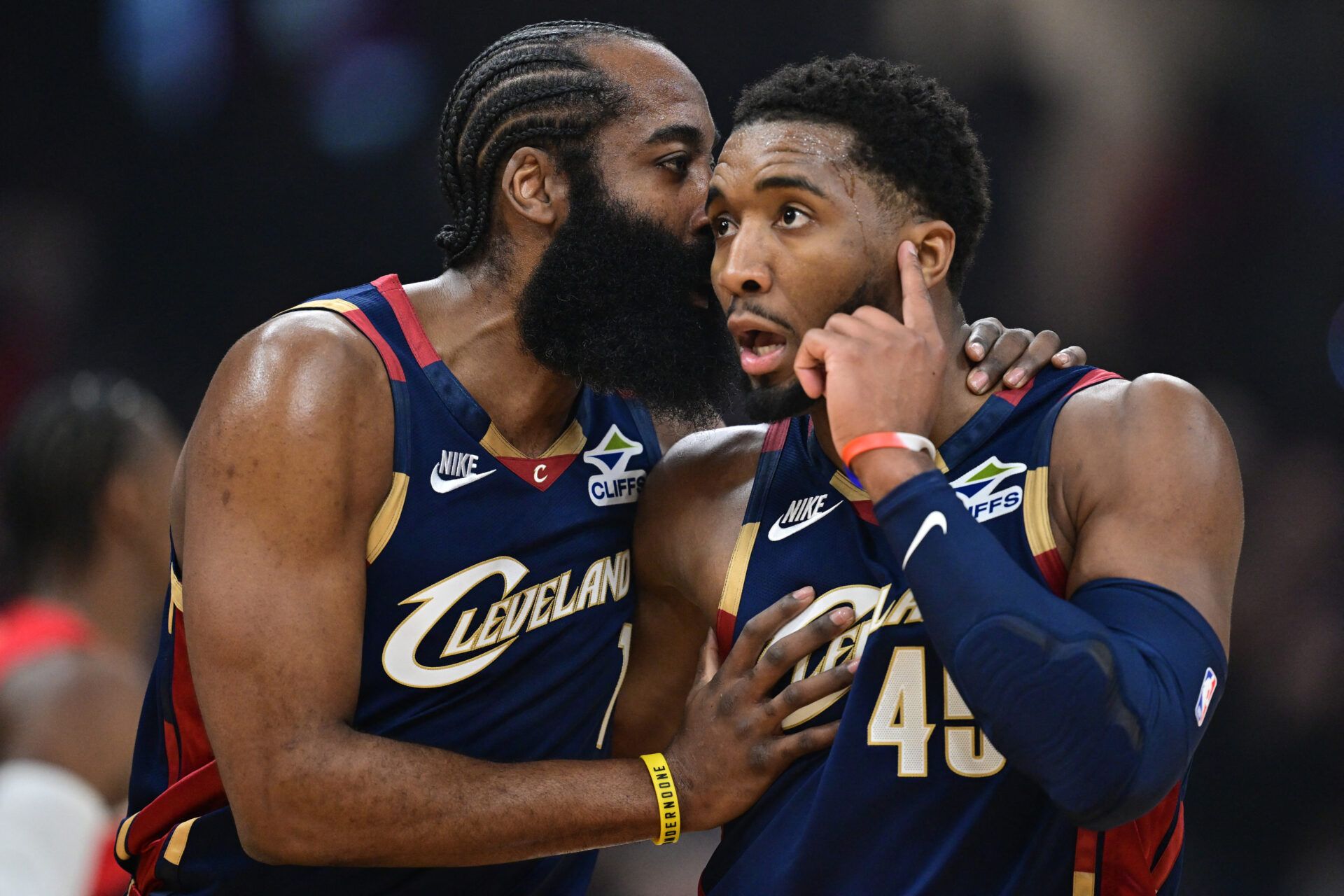 Cleveland Cavaliers guard Donovan Mitchell (45) talks with guard James Harden (1) during the first half during game two of the first round of the 2026 NBA Playoffs against the Toronto Raptors at Rocket Arena.
