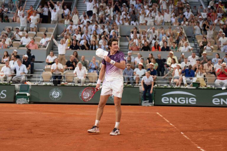 Joao Fonseca of Brazil celebrates winning his match against Novak Djokovic of Serbia on day six at Stade Roland Garros.