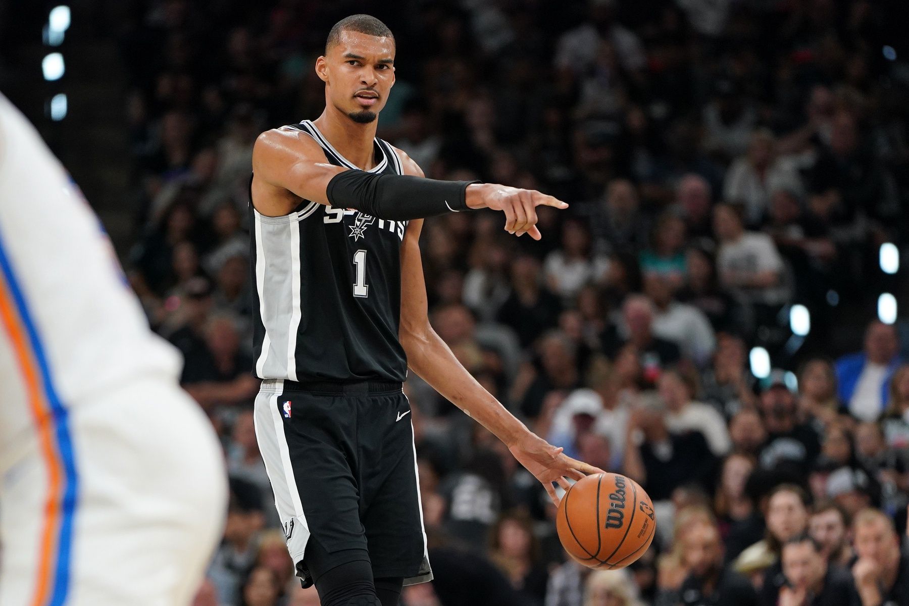 San Antonio Spurs forward Victor Wembanyama (1) dribbles the ball against the Oklahoma City Thunder in the first half during game six of the western conference finals for the 2026 NBA playoffs at Frost Bank Center.