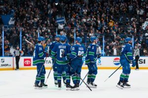 The Vancouver Canucks celebrate their victory at Rogers Arena. 