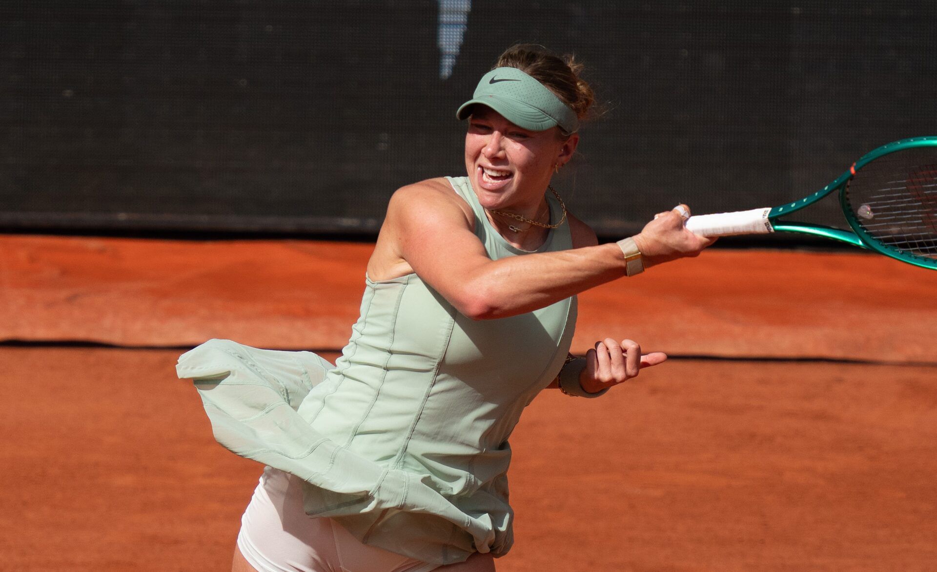 Amanda Anisimova of the United States returns a shot during her match against Diane Parry of France on day seven at Stade Roland Garros.