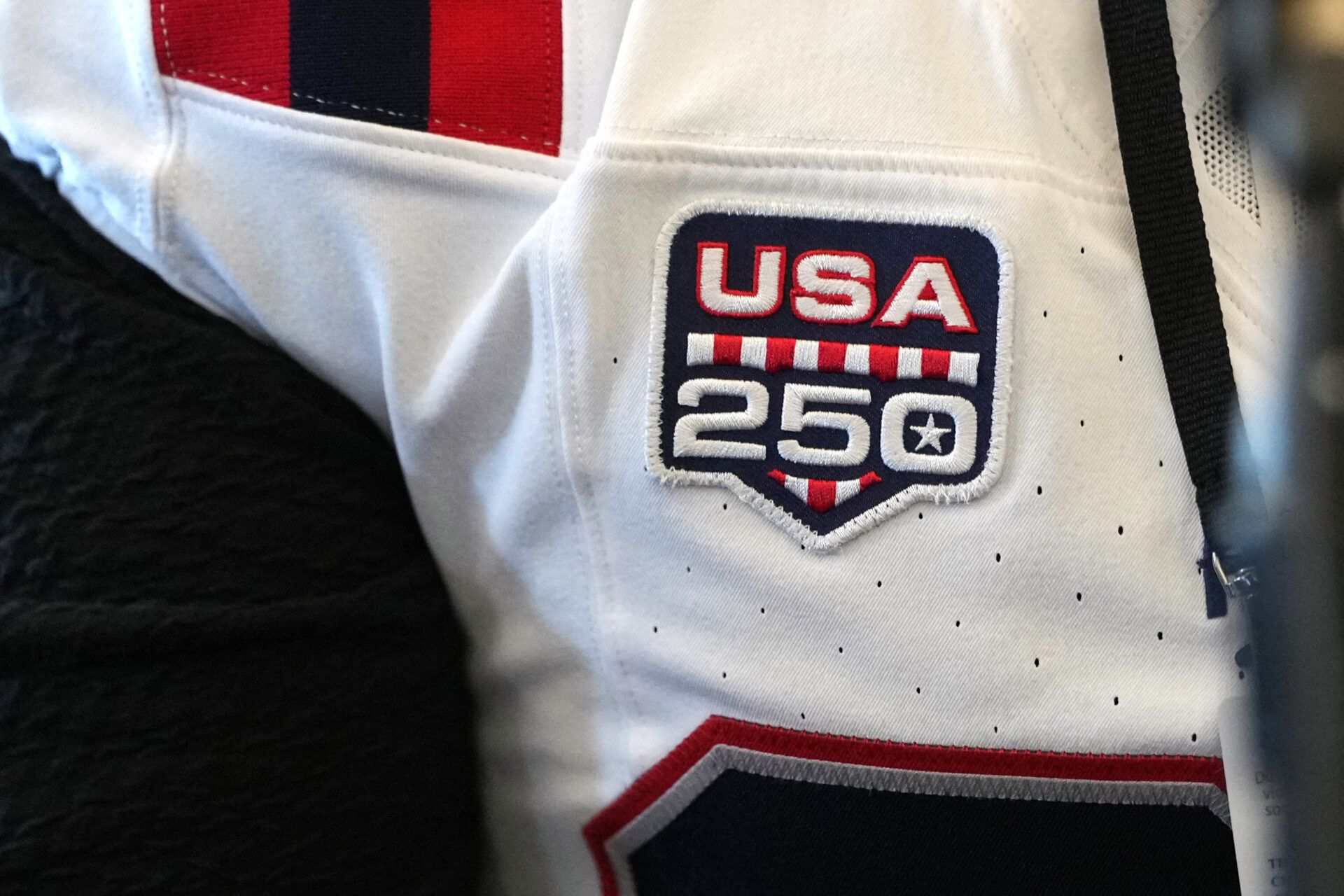 The USA 250 patch appears on the jersey of New England Patriots center Garrett Bradbury (65) at Santa Clara Marriott.