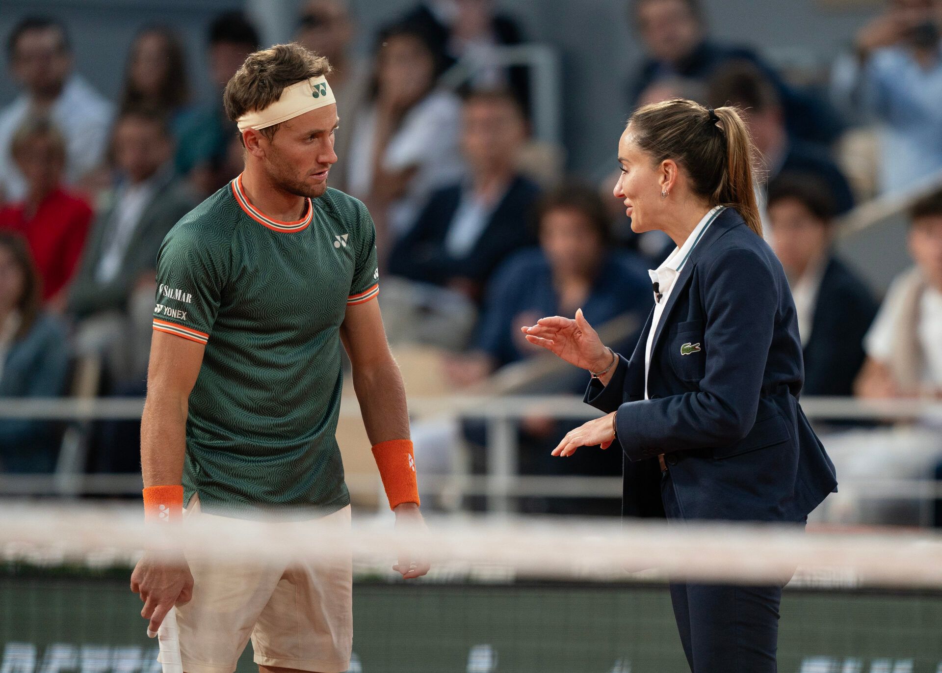 Casper Ruud of Norway discusses a line call with chair umpire, Marijana Veljovic, during his match against Alexander Zverev of Germany on day 13 of Roland Garros at Stade Roland Garros.