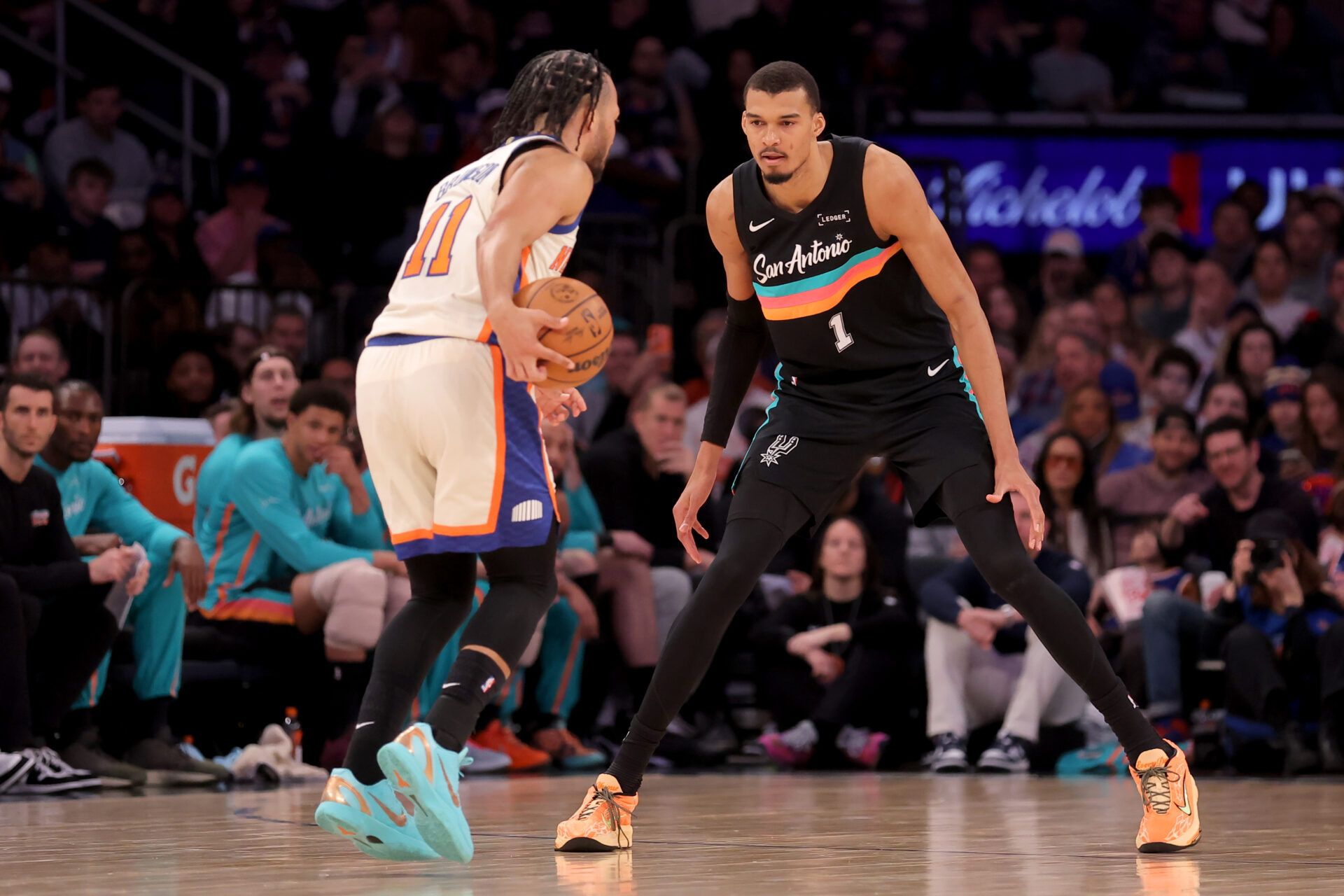 San Antonio Spurs forward Victor Wembanyama (1) defends New York Knicks guard Jalen Brunson (11) during the third quarter at Madison Square Garden.
