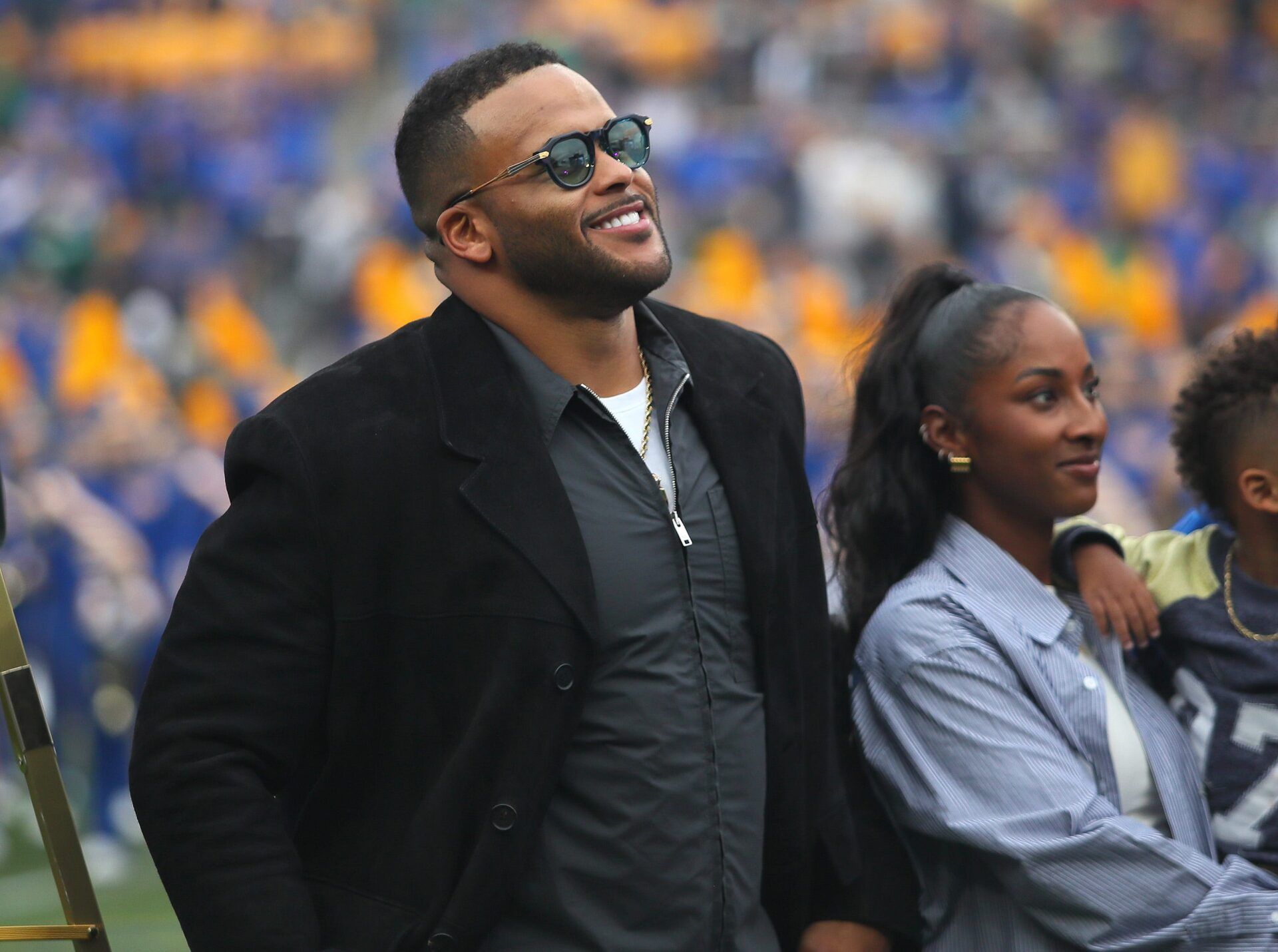 Former Pittsburgh Panther and retired NFL defensive tackle Aaron Donald watches the unveiling of his banner during his jersey number retirement ceremony during halftime of the Pittsburgh Panthers vs Notre Dame Fighting Irish game at Acrisure Stadium in Pittsburgh, PA on November 15, 2025.