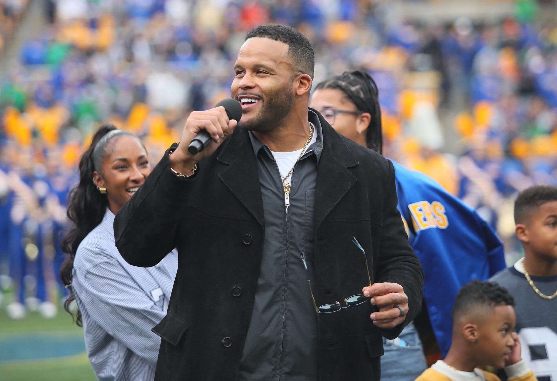Former Pittsburgh Panther and retired NFL defensive tackle Aaron Donald speaks to the crowd during his jersey number retirement ceremony during halftime of the Pittsburgh Panthers vs Notre Dame Fighting Irish game at Acrisure Stadium in Pittsburgh, PA on November 15, 2025.