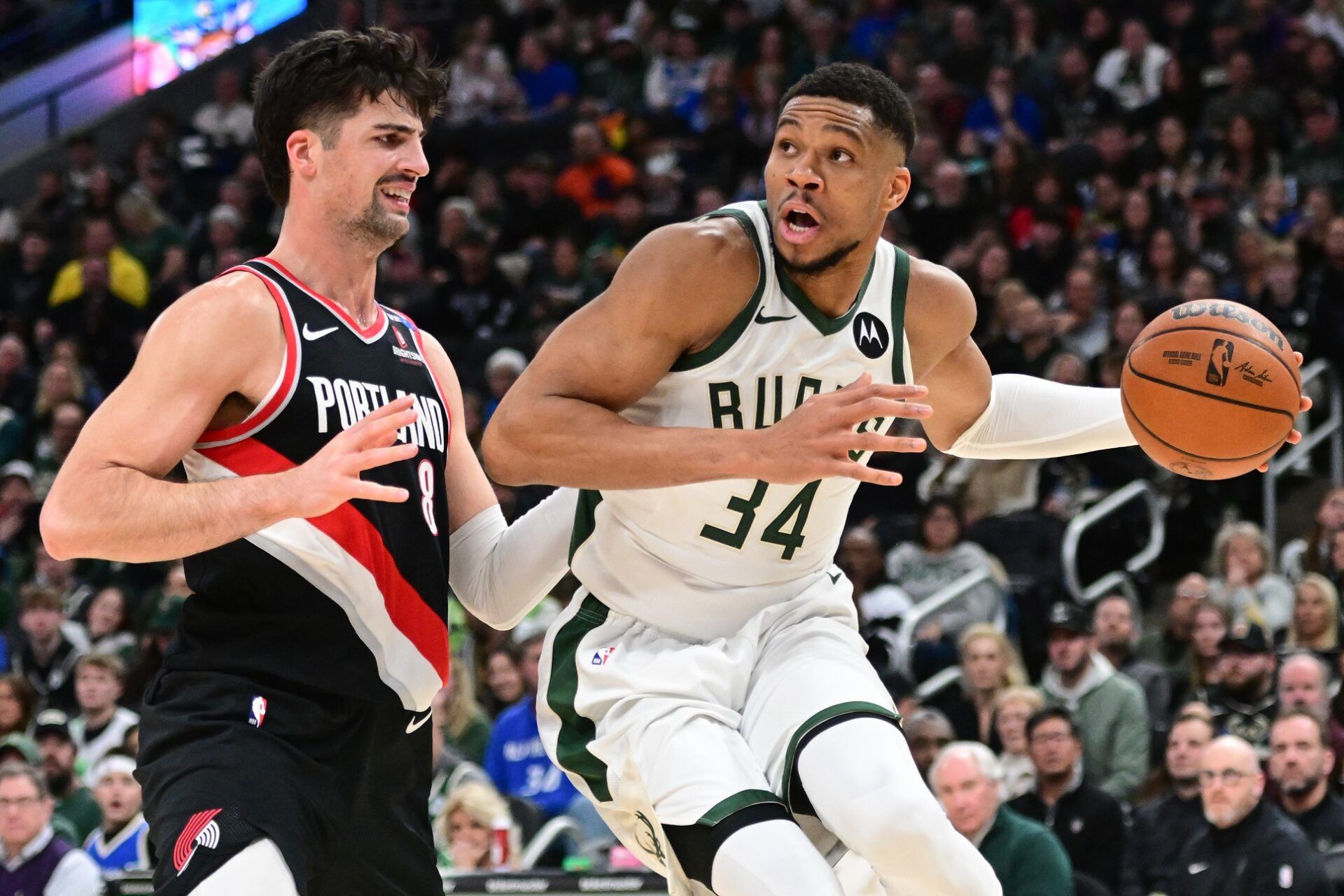 Milwaukee Bucks forward Giannis Antetokounmpo (34) drives for the basket against Portland Trail Blazers forward Deni Avdija (8) in the fourth quarter at Fiserv Forum.