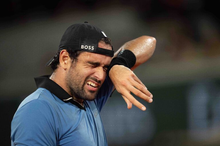 Matteo Berrettini of Italy reacts during his match against Matteo Arnaldi of Italy on day 11 at Stade Roland Garros.