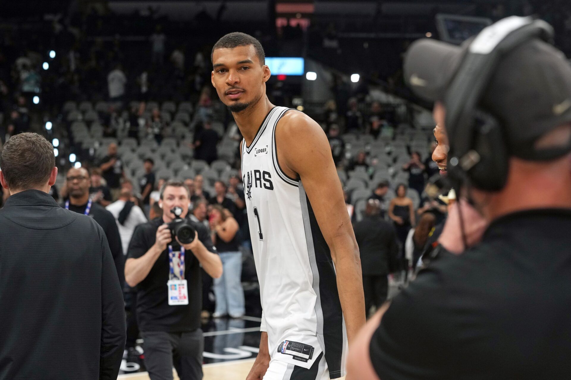 San Antonio Spurs forward Victor Wembanyama (1) leaves the court after a victory over the Portland Trail Blazers in game five of the first round of the 2026 NBA Playoffs at Frost Bank Center.