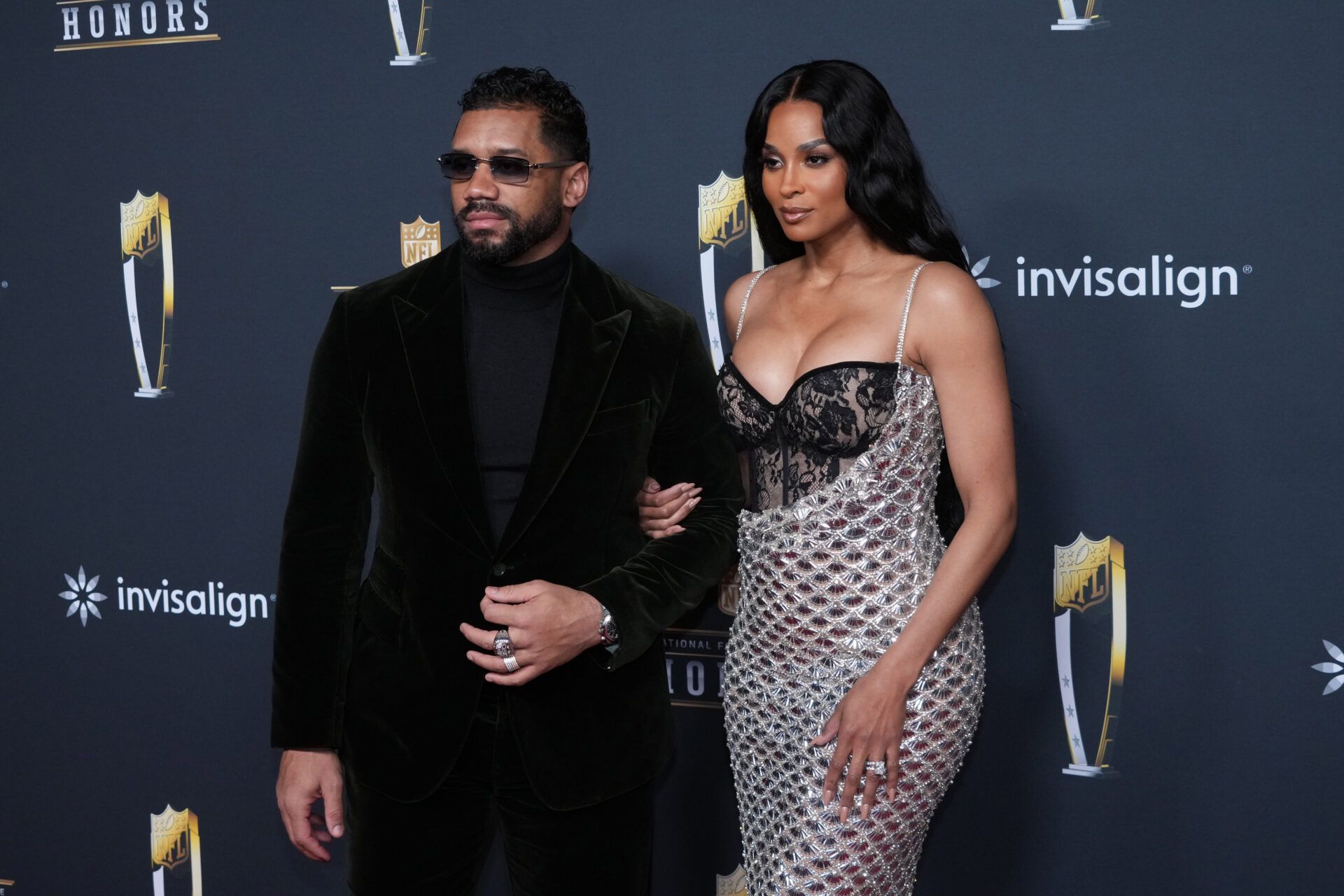 Russell Wilson (left) and wife Ciara pose on the NFL Honors Red Carpet before Super Bowl LX at Palace of Fine Arts.