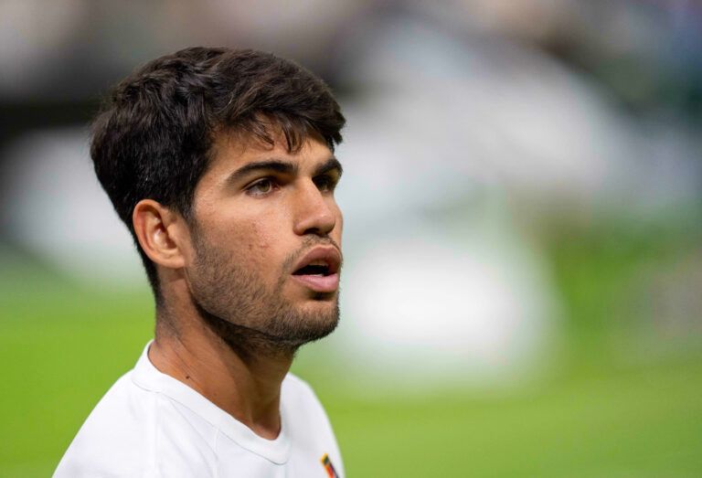 Carlos Alcaraz of Spain looks on during his match against Andrey Rublev on day seven at the All England Lawn Tennis and Croquet Club.