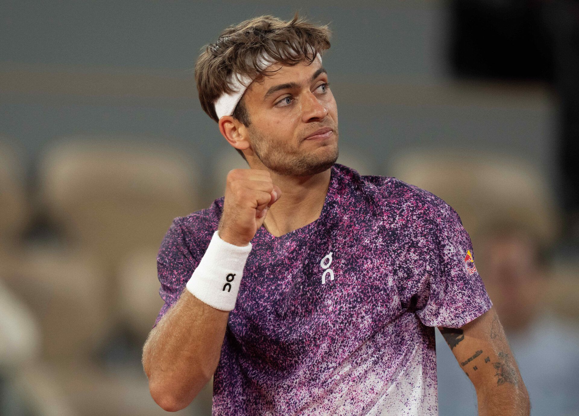 Flavio Cobolli of Italy reacts during his match against Felix Auger-Aliassime of Canada on day 11 at Stade Roland Garros.
