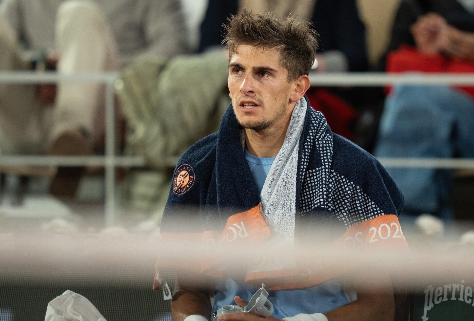 Matteo Arnaldi of Italy at a change of ends during his match against Matteo Berrettini of Italy on day 11 at Stade Roland Garros.