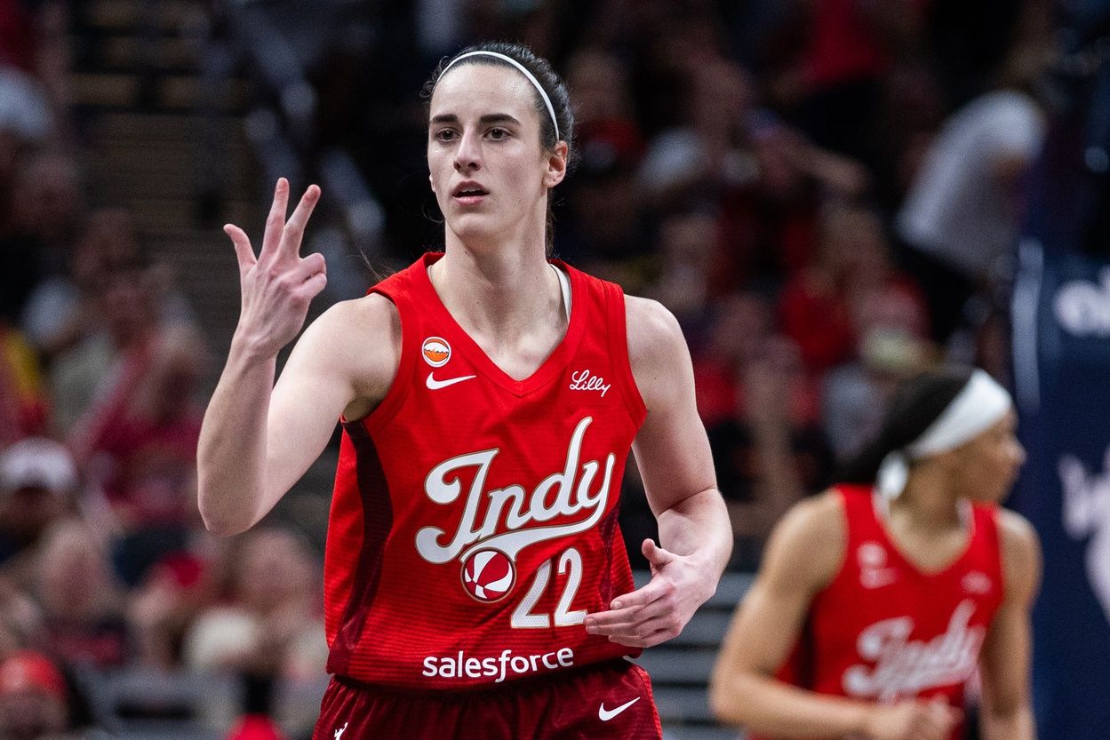 Indiana Fever guard Caitlin Clark (22) gestures after making a three-point basket in the second half against the Atlanta Dream at Gainbridge Fieldhouse.