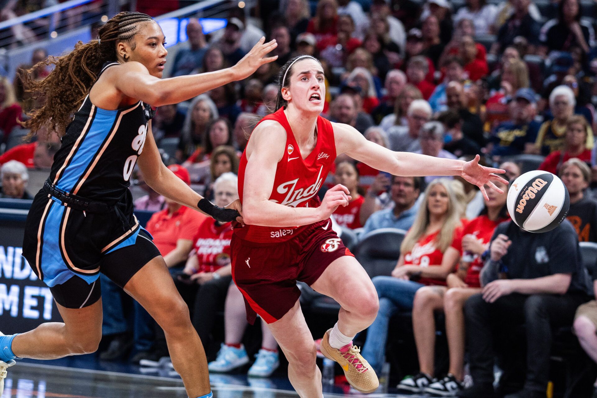 Indiana Fever guard Caitlin Clark (22) drives to the basket against Atlanta Dream forward Naz Hillmon (00) during the first half at Gainbridge Fieldhouse.