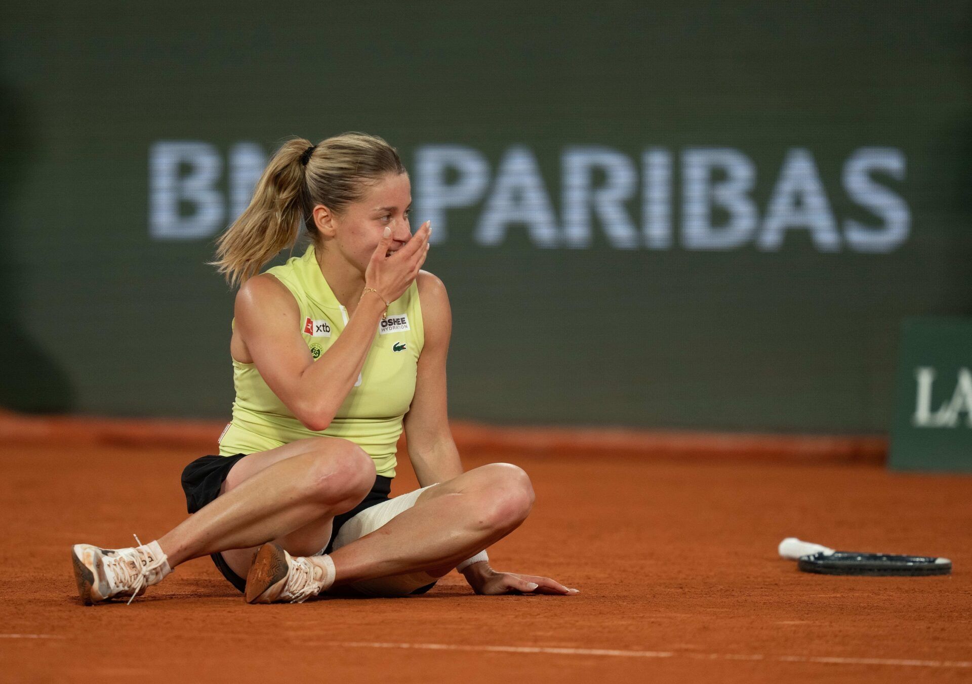 Maja Chwalinska of Poland celebrates winning her match against Diana Shnaider on day 12 at Stade Roland Garros.