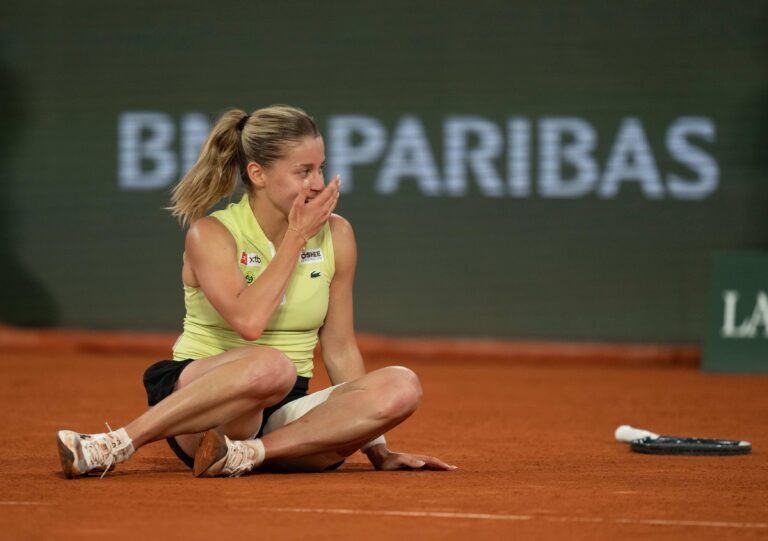 Maja Chwalinska of Poland celebrates winning her match against Diana Shnaider on day 12 at Stade Roland Garros.
