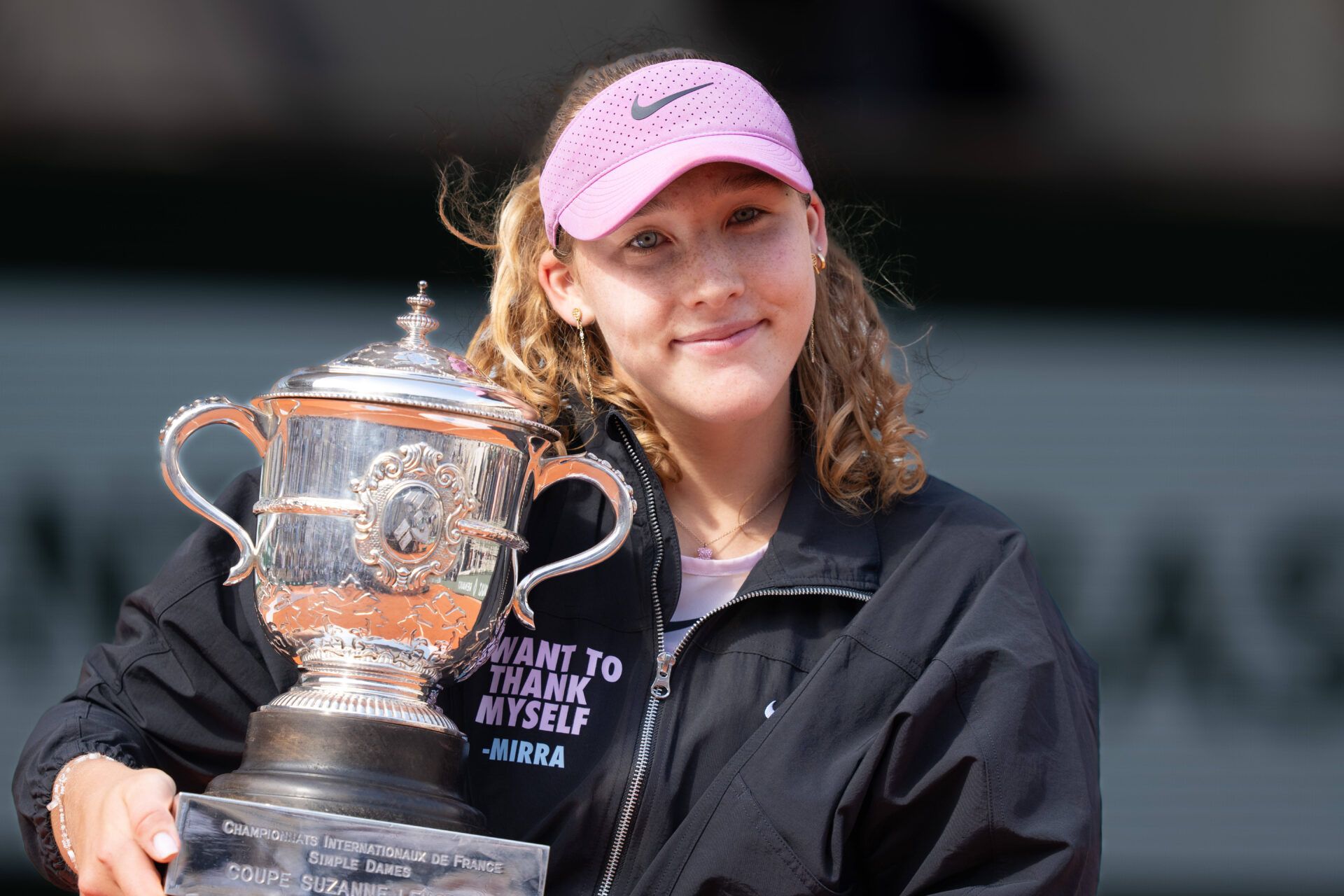 Mirra Andreeva poses with the trophy after winning the womenÕs singles final against Maja Chwalinska of Poland at Stade Roland Garros.