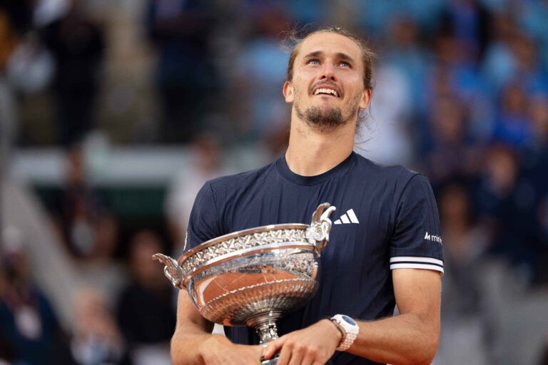 Alexander Zverev of Germany poses with the trophy after winning the mens singles final against Flavio Cobolli of Italy on day 15  at Stade Roland Garros.