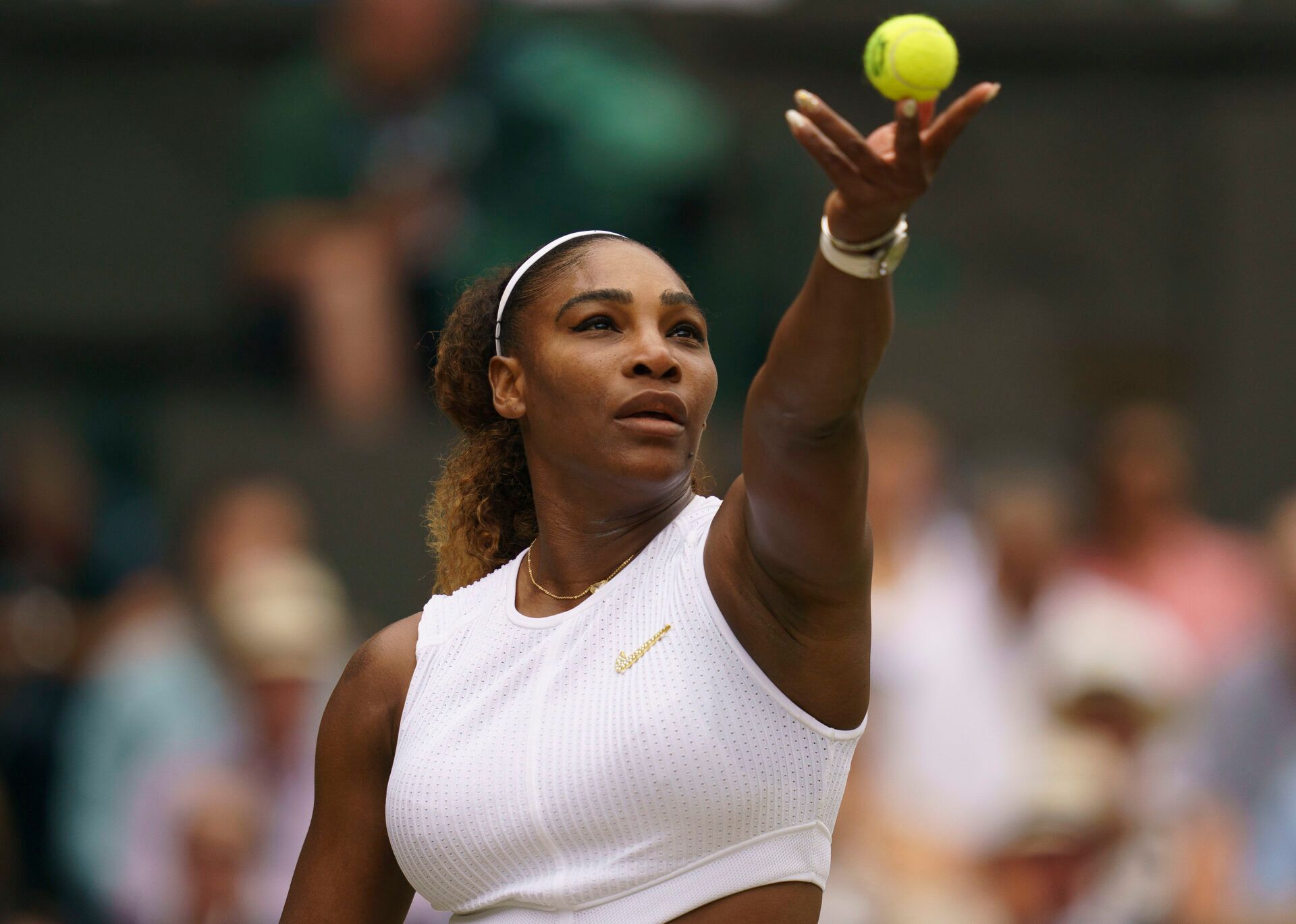 Serena Williams (USA) serves during a match against Simona Halep (ROU) on day 12 at the All England Lawn and Croquet Club.