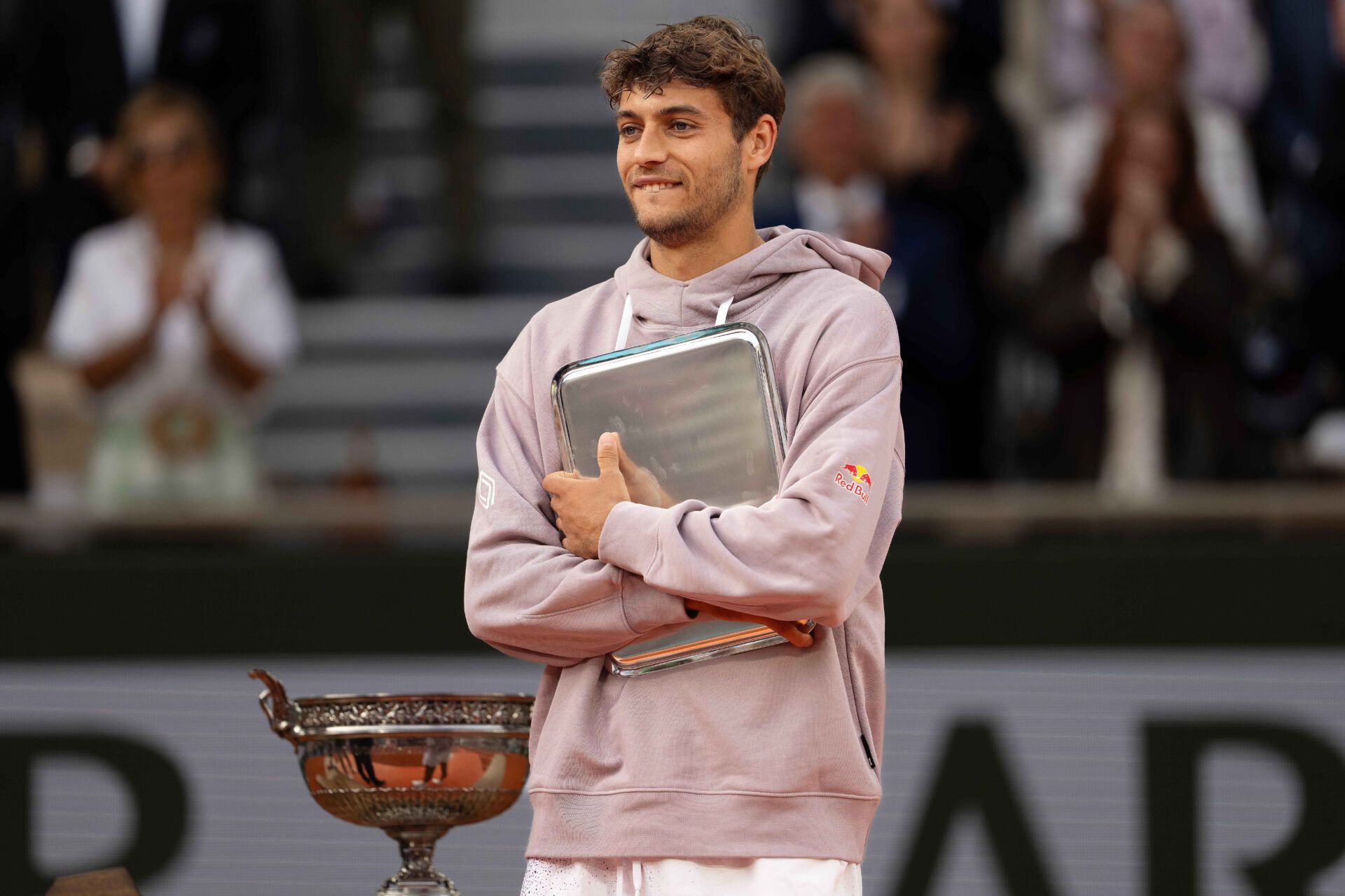 Flavio Cobolli of Italy at the trophy presentation after losing the mens final against Alexander Zverev of Germany on day 15  at Stade Roland Garros.