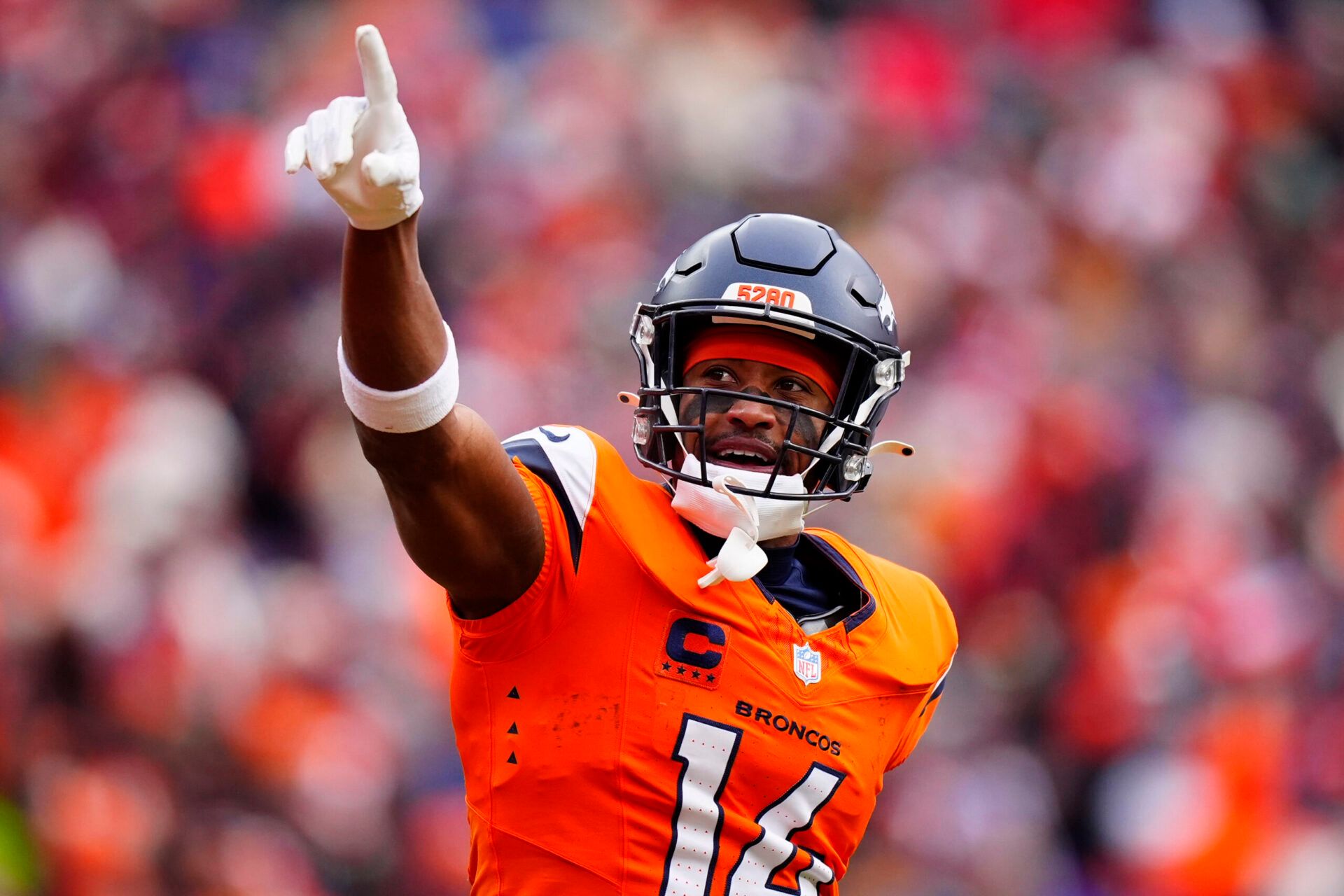 Denver Broncos wide receiver Courtland Sutton (14) reacts after catching a touchdown pass against the New England Patriots during the first half in the 2026 AFC Championship Game at Empower Field at Mile High.