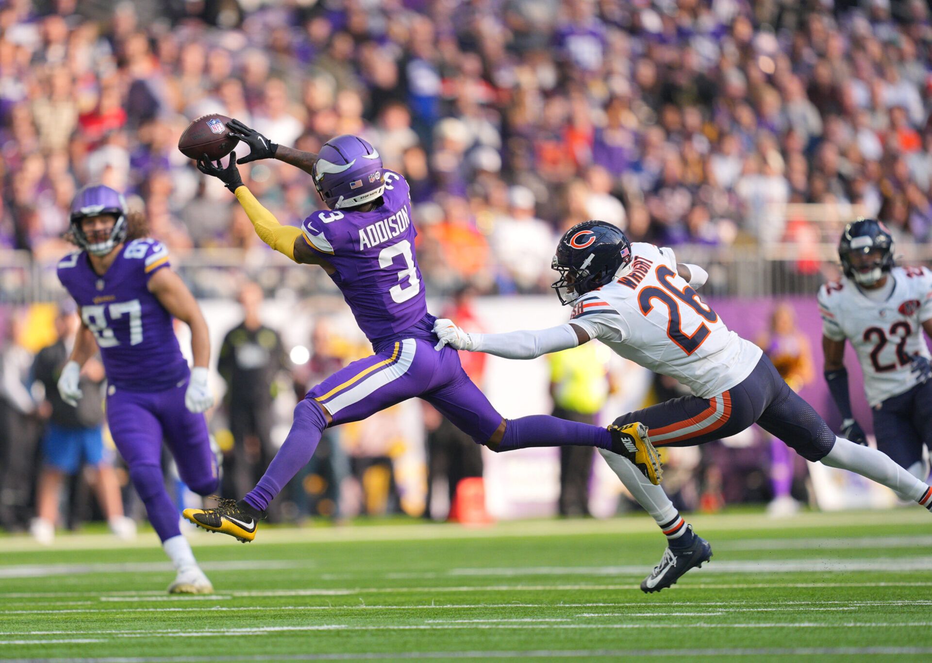 Minnesota Vikings wide receiver Jordan Addison (3) misses a catch while under pressure from Chicago Bears cornerback Nahshon Wright (26) during the first quarter at U.S. Bank Stadium.