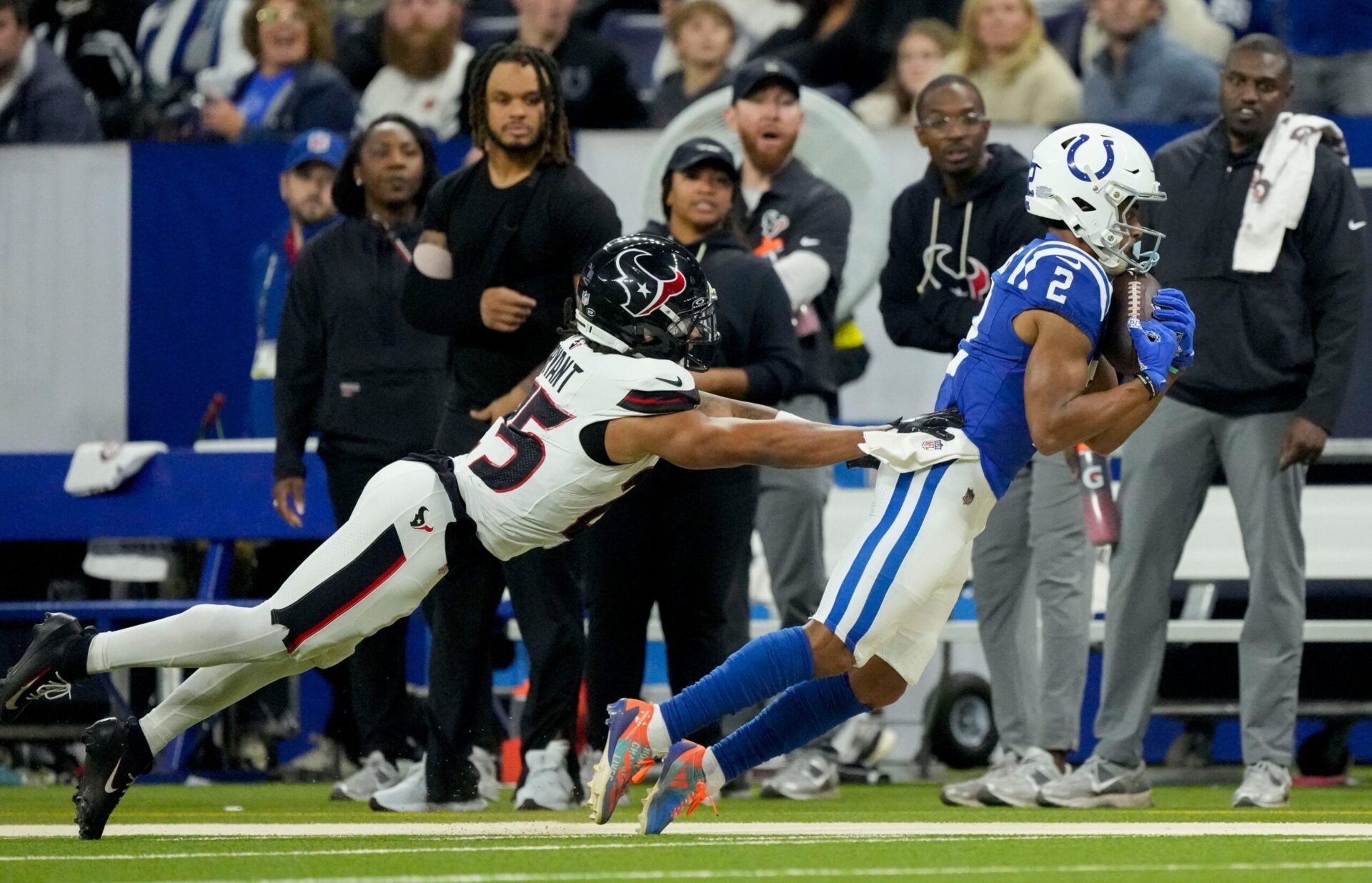 Indianapolis Colts wide receiver Josh Downs (2) makes a catch in front of Houston Texans cornerback Myles Bryant (25) on Sunday, Nov. 30, 2025, during a game at Lucas Oil Stadium in Indianapolis.