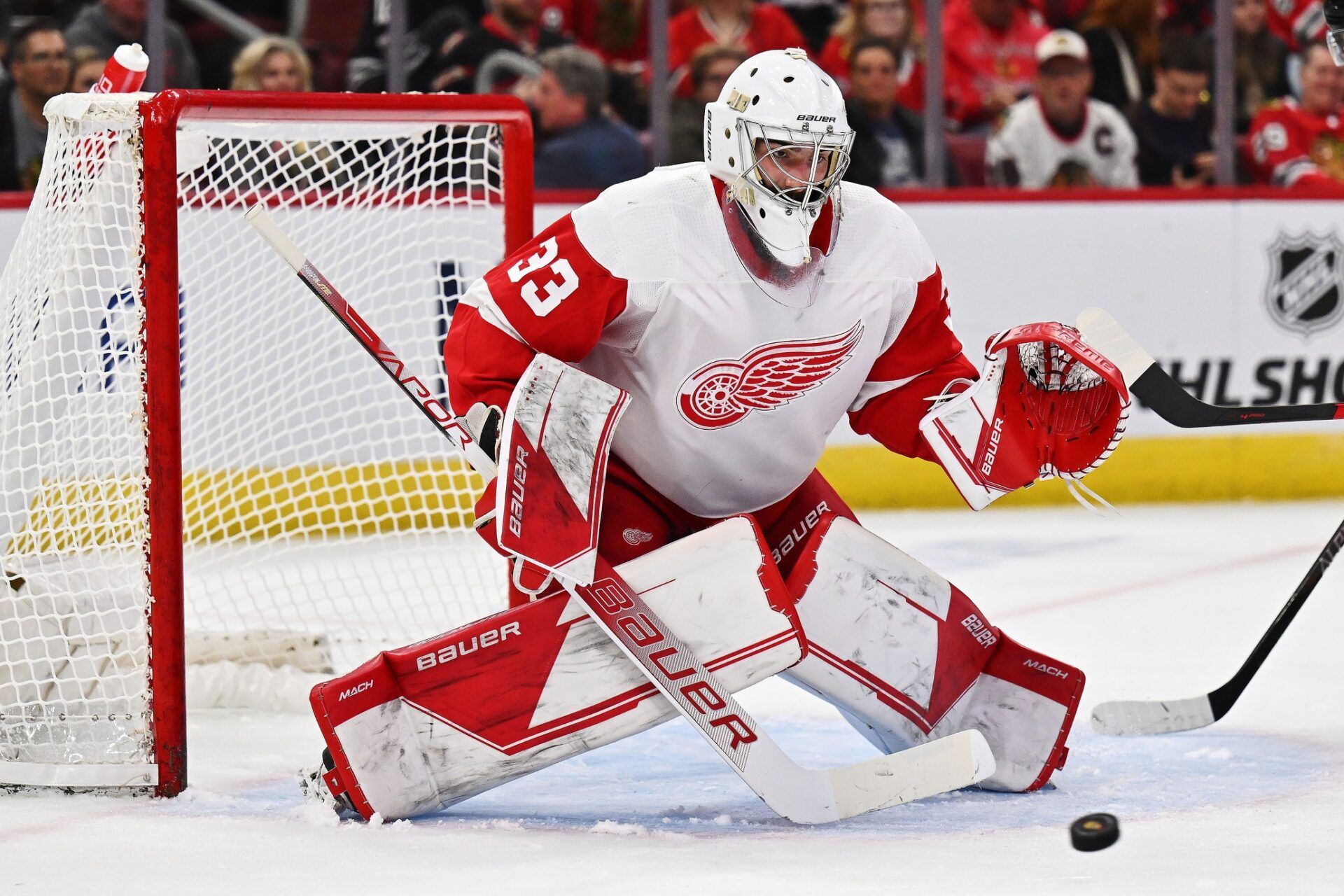 Detroit Red Wings goaltender Sebastian Cossa (33) defends the net against the Chicago Blackhawks at United Center.