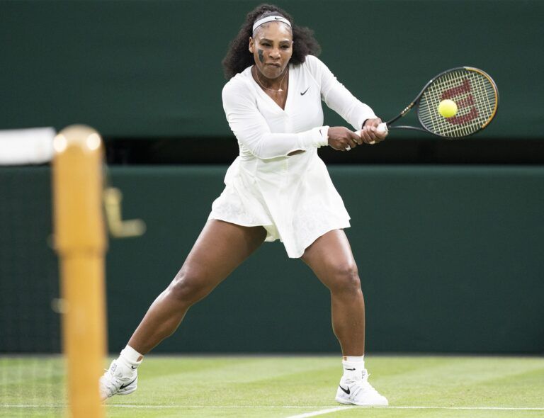 Serena Williams (USA) returns a shot during her first round match against Harmony Tan (FRA) on day two at All England Lawn Tennis and Croquet Club.
