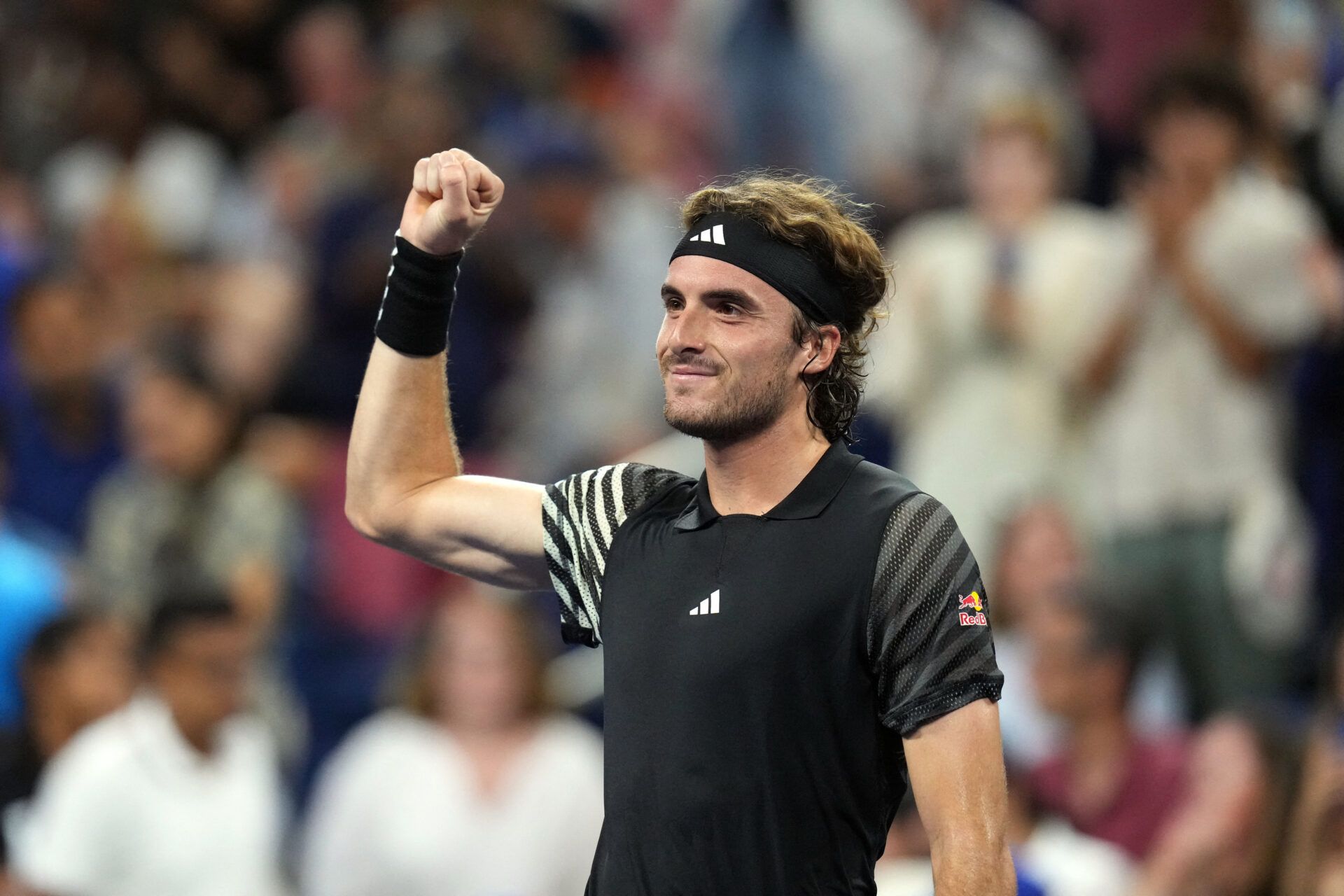 Stefanos Tsitsipas of Greece defeats Milos Raonic of Canada on day one of the 2023 U.S. Open at the Billie Jean King Tennis Center.