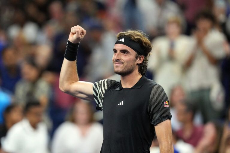 Stefanos Tsitsipas of Greece defeats Milos Raonic of Canada on day one of the 2023 U.S. Open at the Billie Jean King Tennis Center.