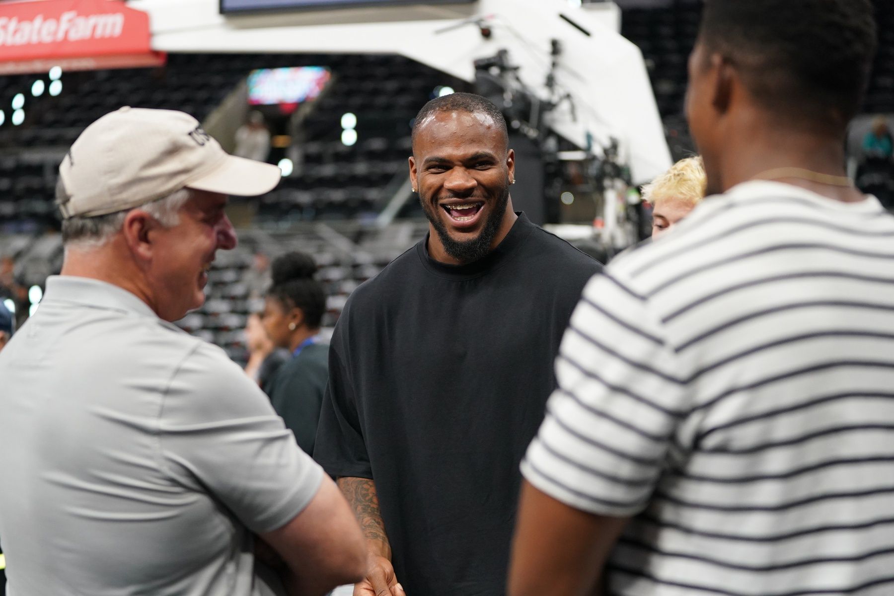 Green Bay Packers defensive end Micah Parsons talks to fans before the start of game six of the western conference finals for the 2026 NBA playoffs at Frost Bank Center.