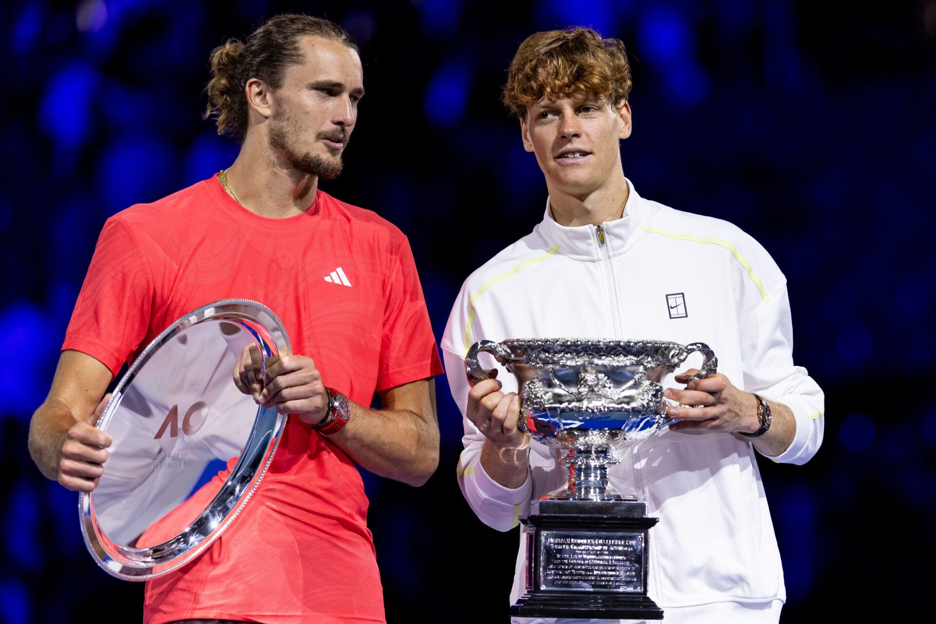 Jannik Sinner of Italy and Alexander Zverev of Germany share a moment during the prize presentation of the men's single final at the 2025 Australian Open at Melbourne Park.