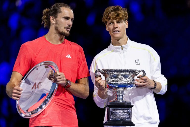 Jannik Sinner of Italy and Alexander Zverev of Germany share a moment during the prize presentation of the men's single final at the 2025 Australian Open at Melbourne Park.